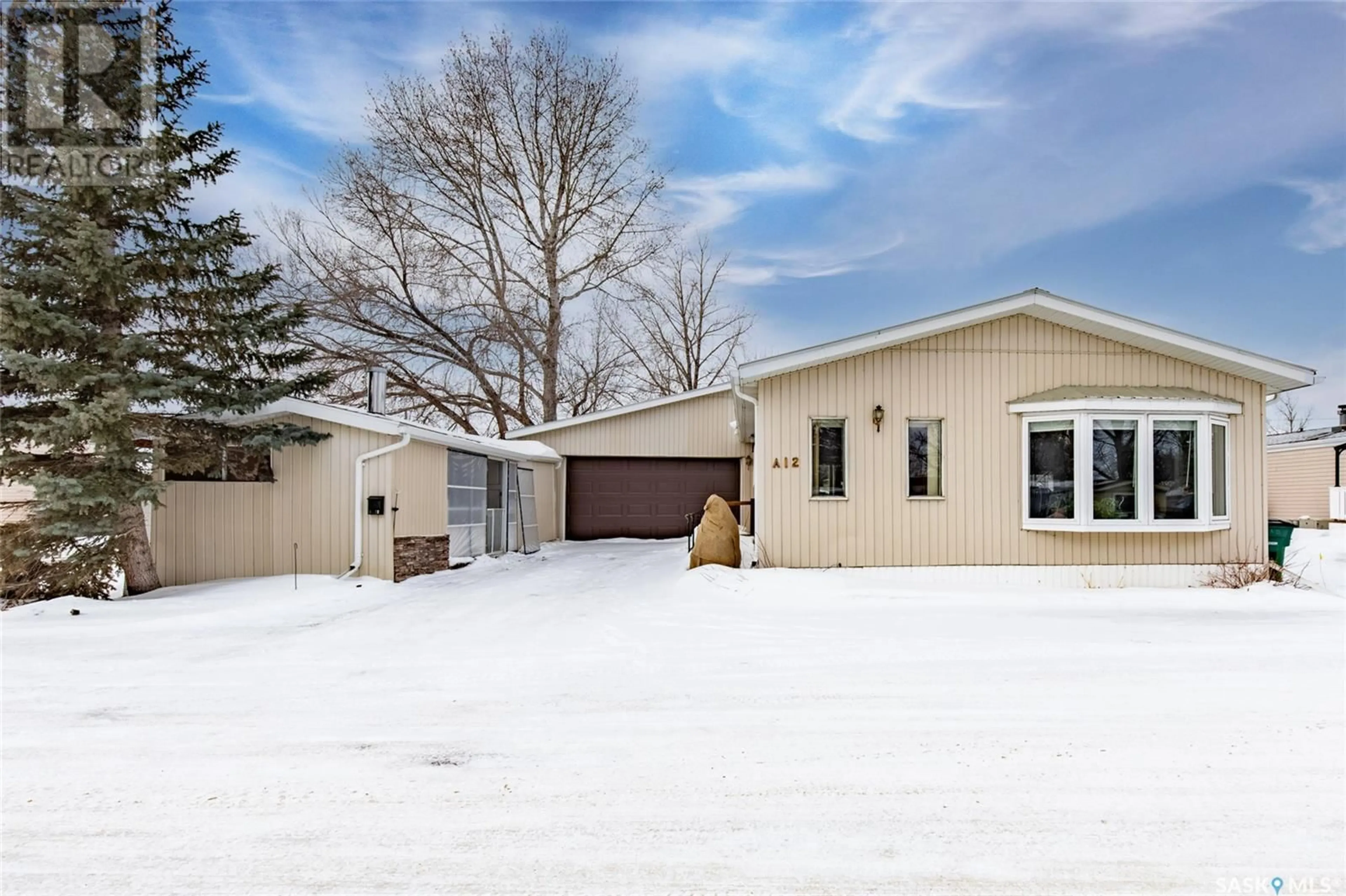 Home with vinyl exterior material, street for A12 1455 9th AVENUE NE, Moose Jaw Saskatchewan S6J1C6