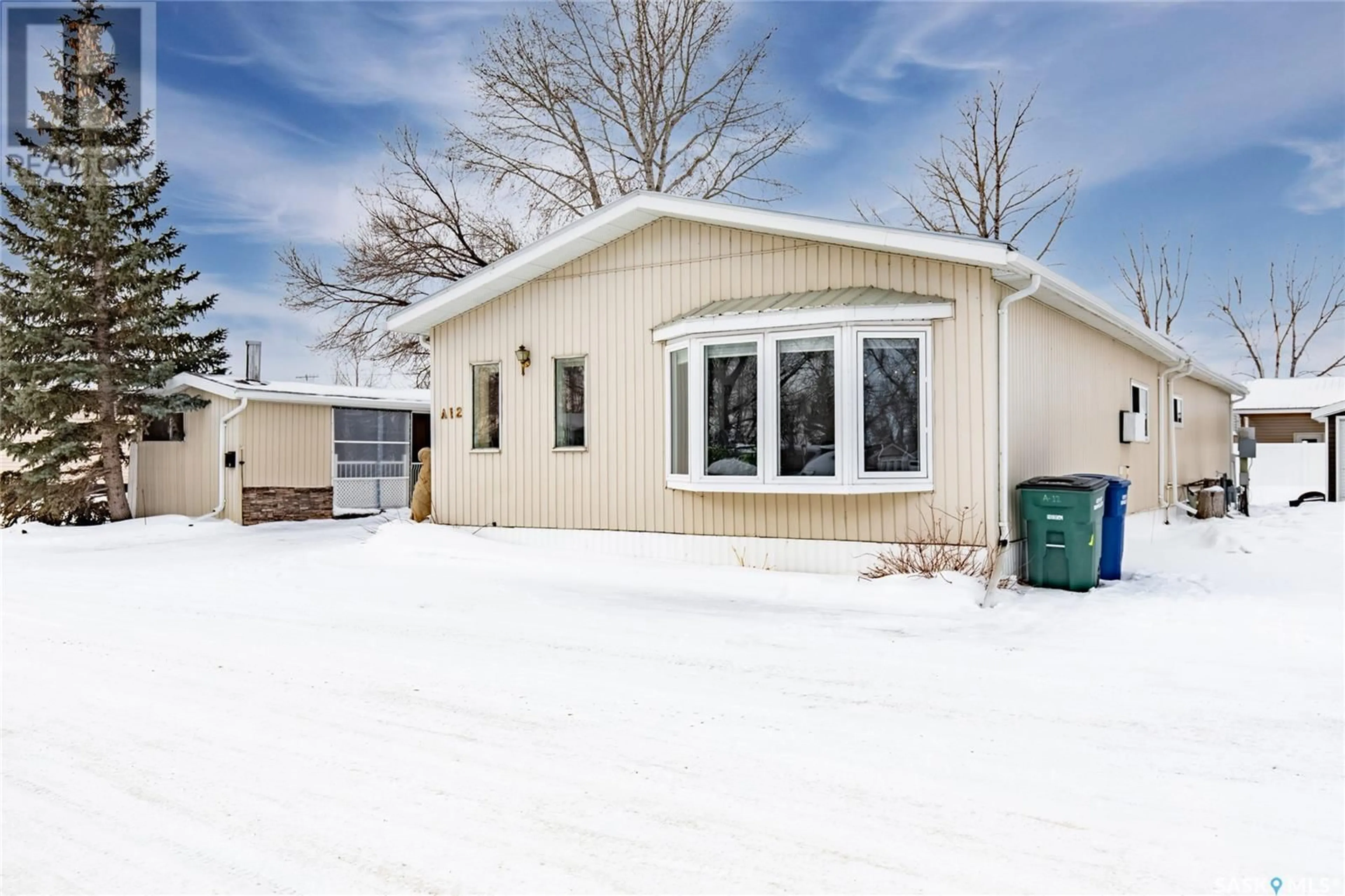 Home with vinyl exterior material, street for A12 1455 9th AVENUE NE, Moose Jaw Saskatchewan S6J1C6