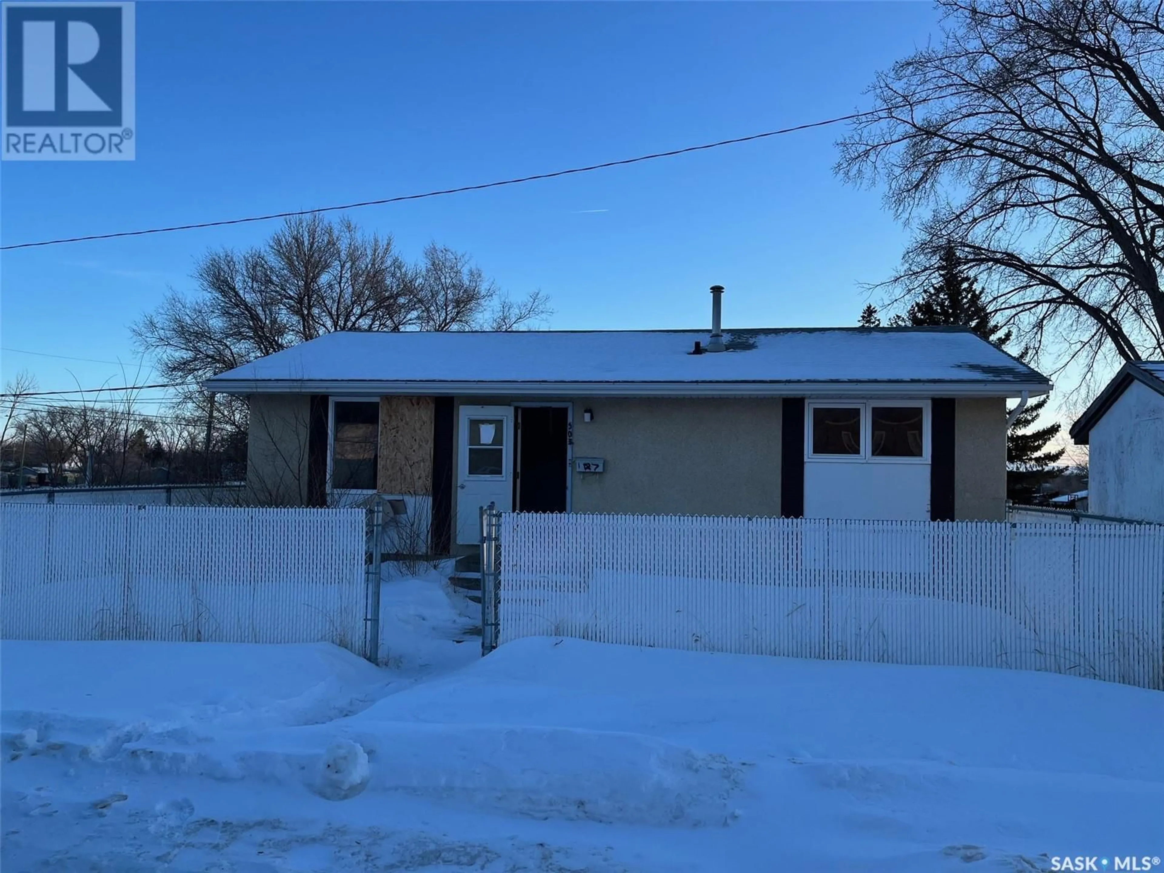 A pic from outside/outdoor area/front of a property/back of a property/a pic from drone, street for 503 Hall STREET E, Moose Jaw Saskatchewan S6H6L9