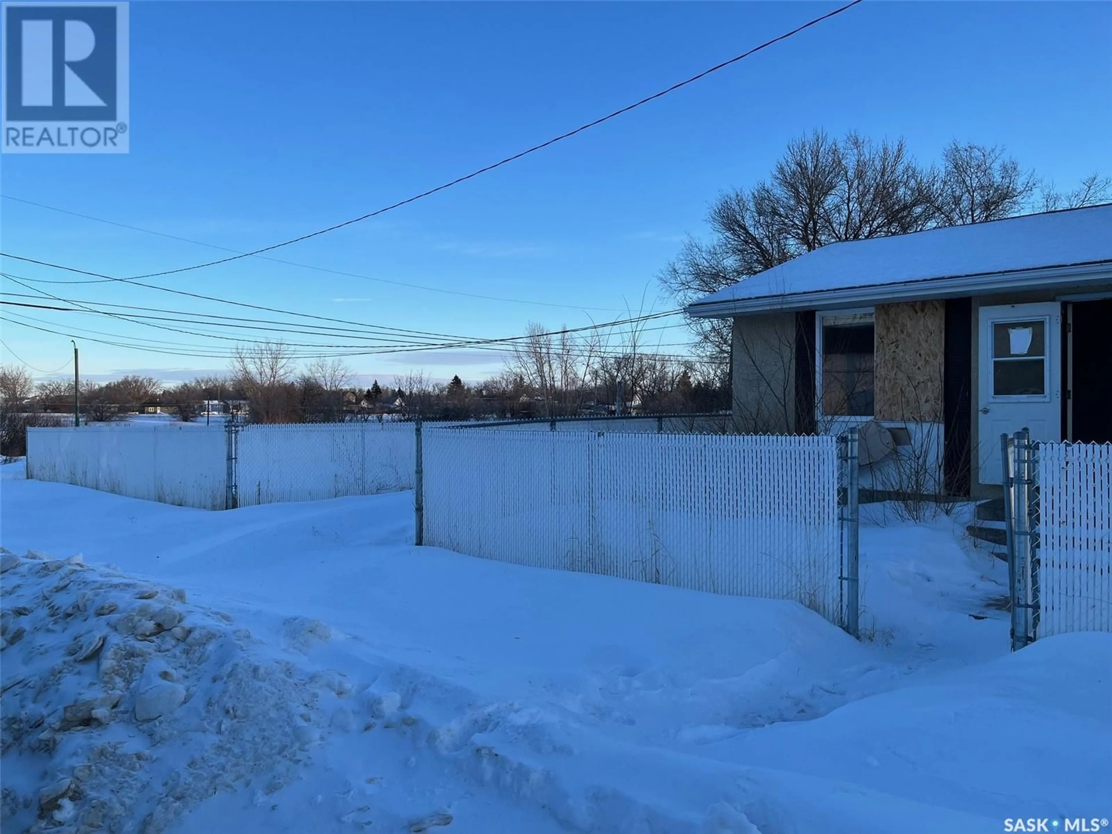 A pic from outside/outdoor area/front of a property/back of a property/a pic from drone, street for 503 Hall STREET E, Moose Jaw Saskatchewan S6H6L9