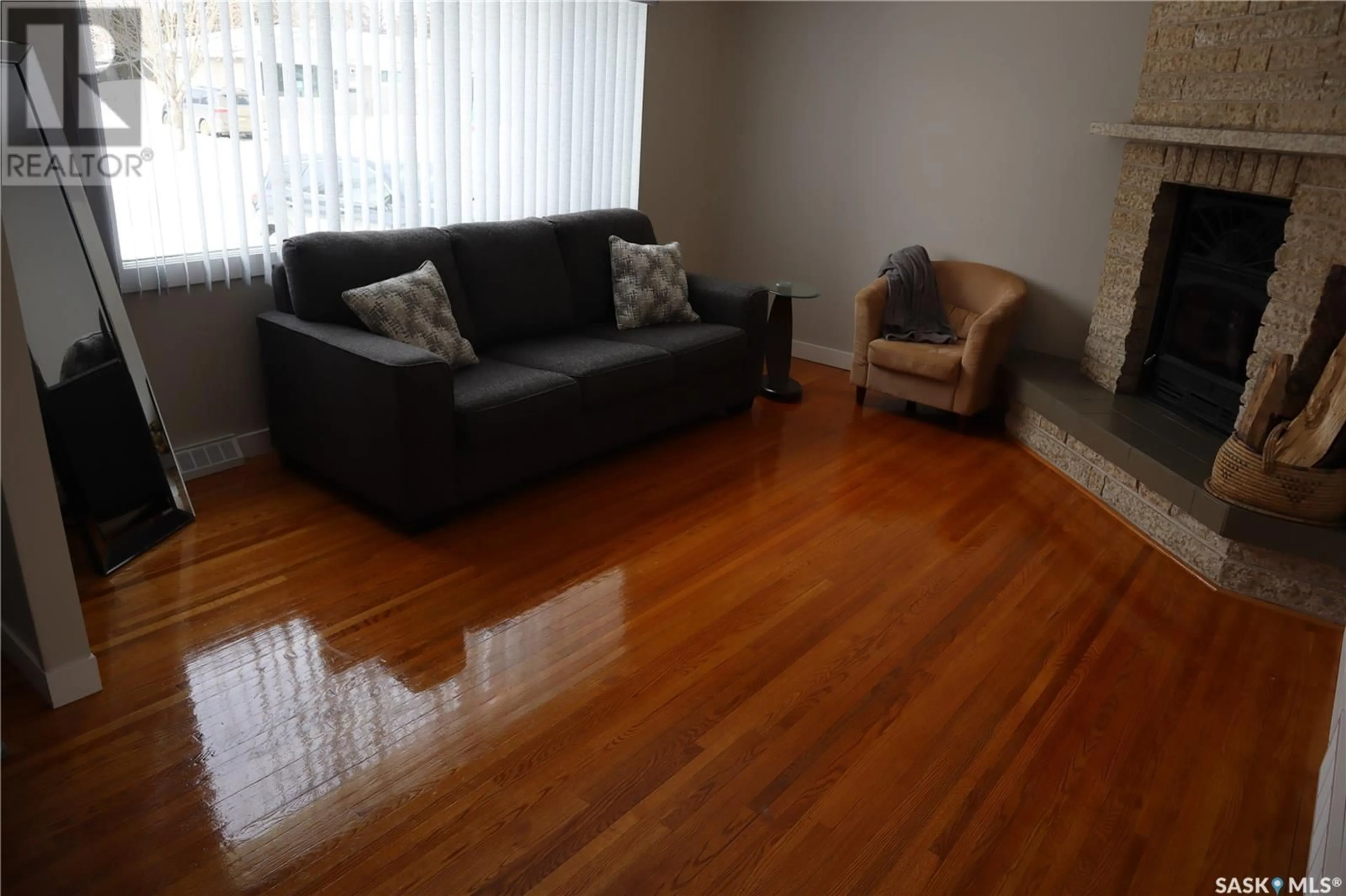 Living room with furniture, wood/laminate floor for 36 MACDERMID CRESCENT, Saskatoon Saskatchewan S7J2R2