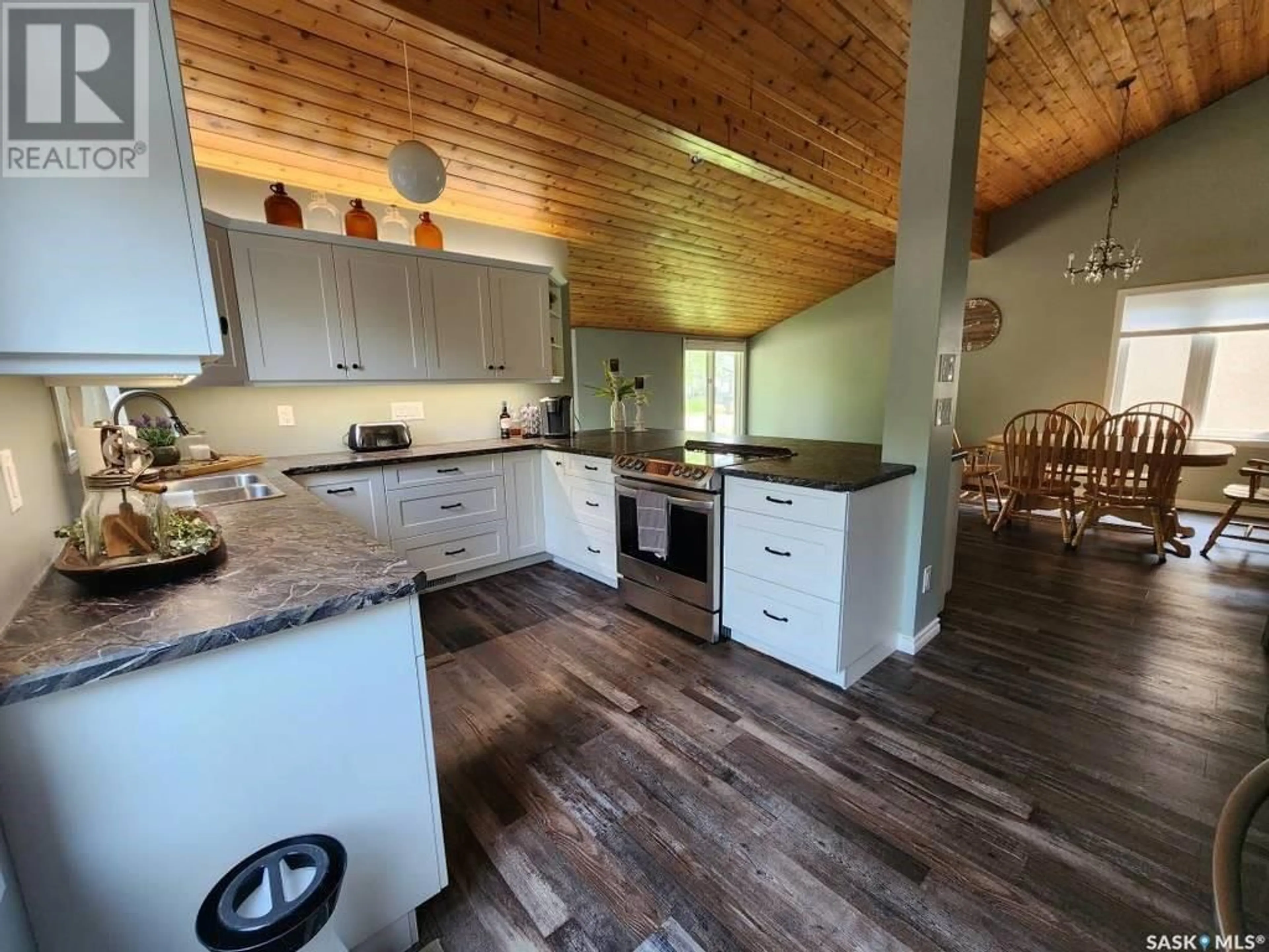 Open concept kitchen, wood/laminate floor for 47 8th STREET NE, Wadena Saskatchewan S0A4J0