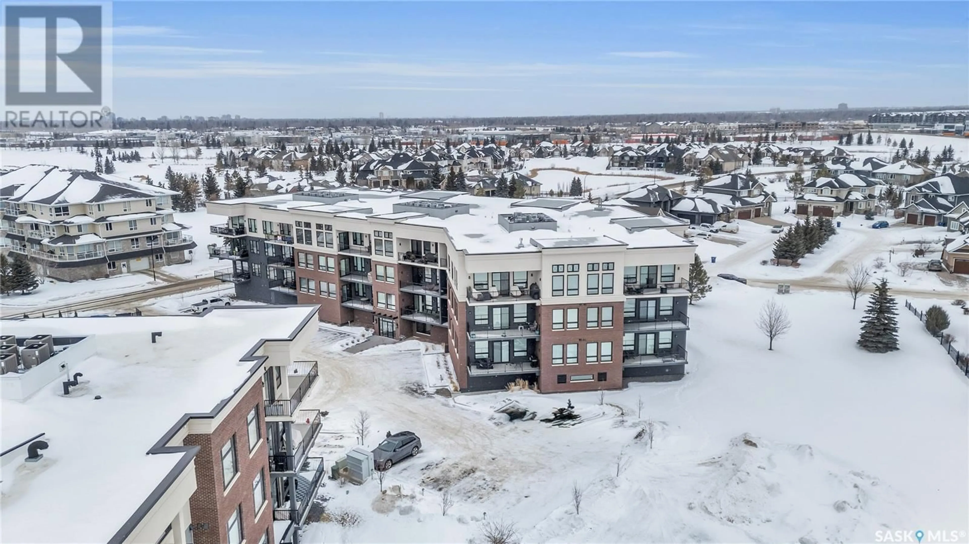 A pic from outside/outdoor area/front of a property/back of a property/a pic from drone, building for 210 408 Cartwright STREET, Saskatoon Saskatchewan S7T0X1