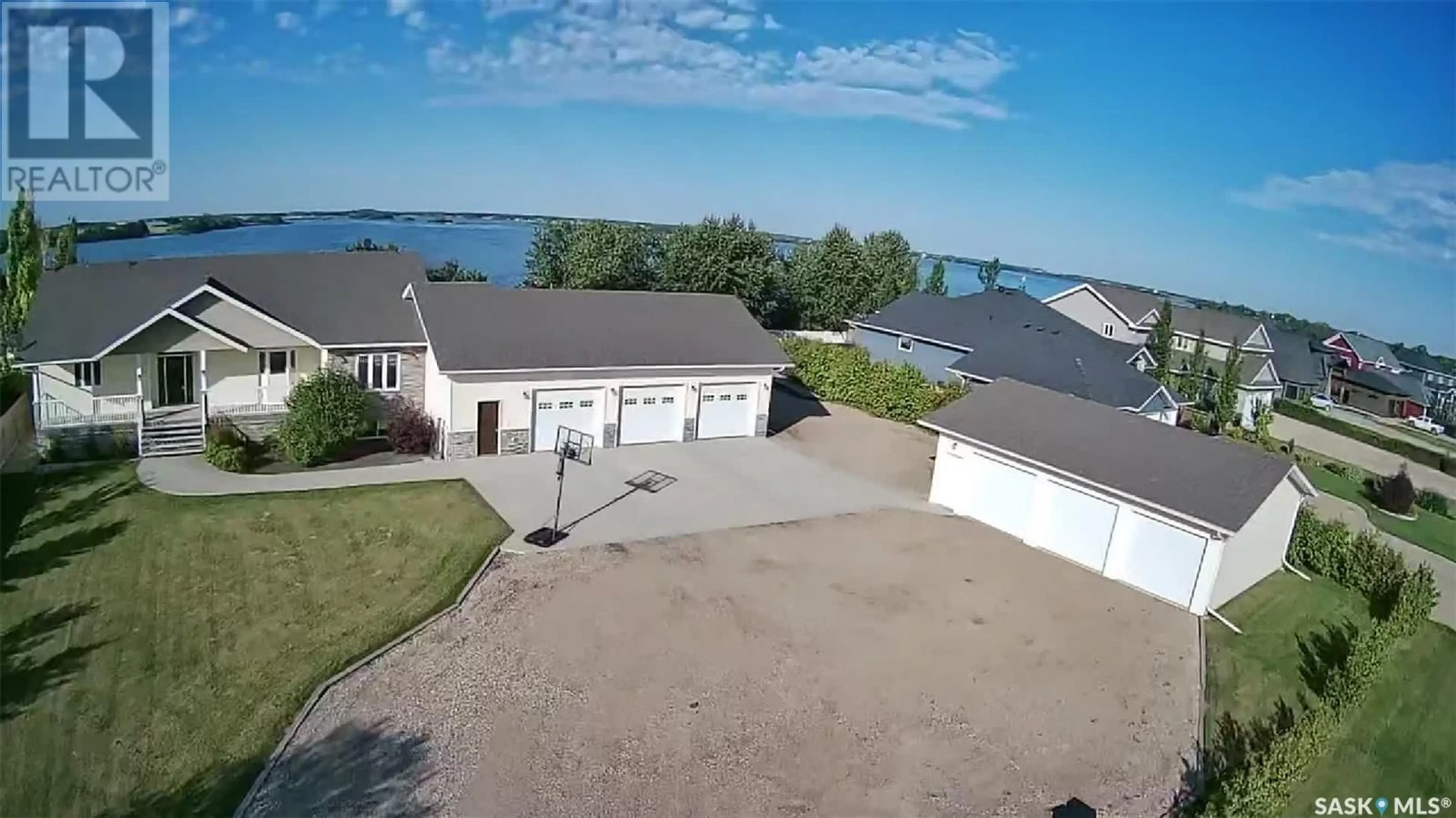 A pic from outside/outdoor area/front of a property/back of a property/a pic from drone, water/lake/river/ocean view for 26 PAPE DRIVE, Humboldt Lake Saskatchewan S0K2A0