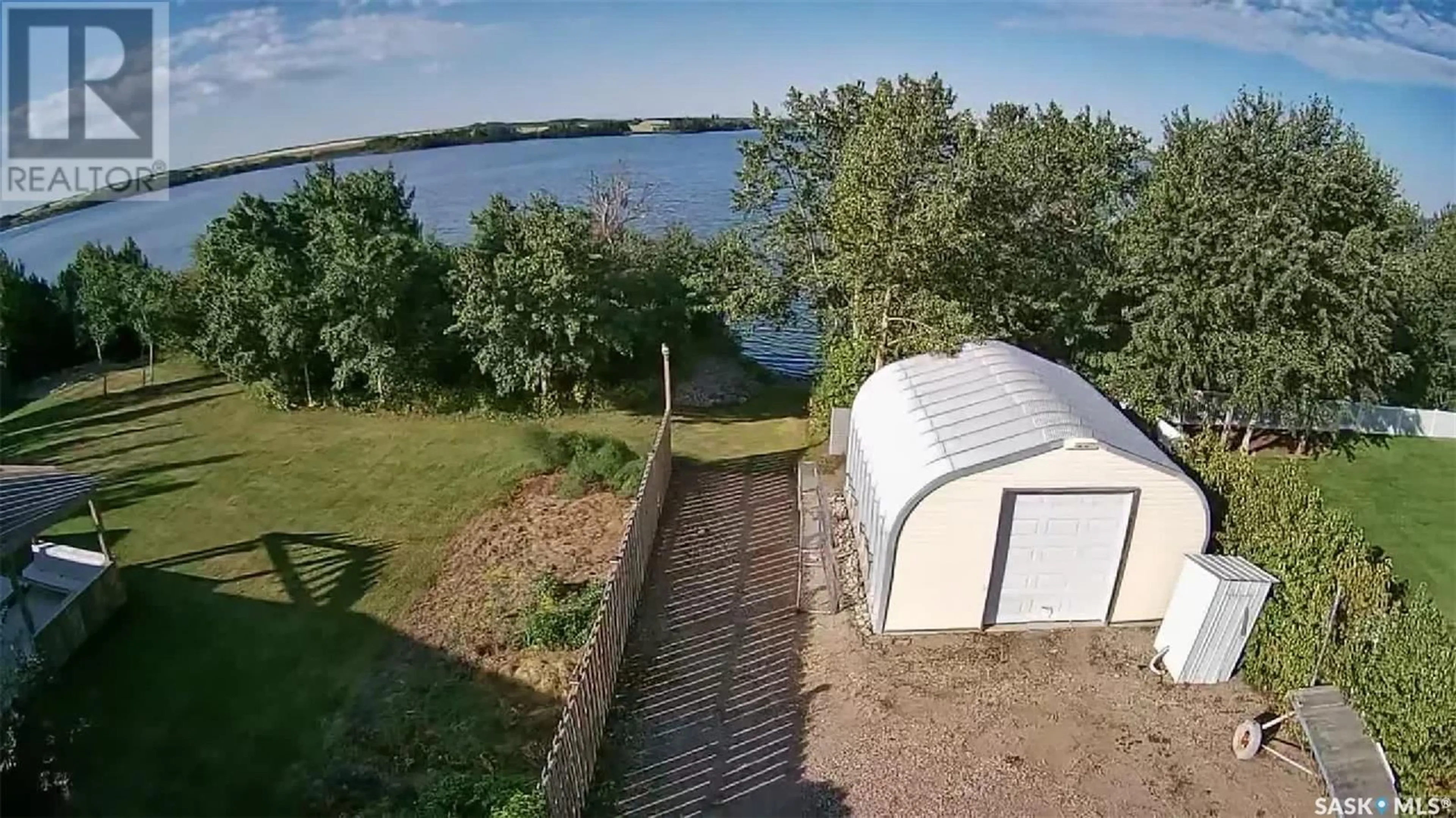 A pic from outside/outdoor area/front of a property/back of a property/a pic from drone, water/lake/river/ocean view for 26 PAPE DRIVE, Humboldt Lake Saskatchewan S0K2A0