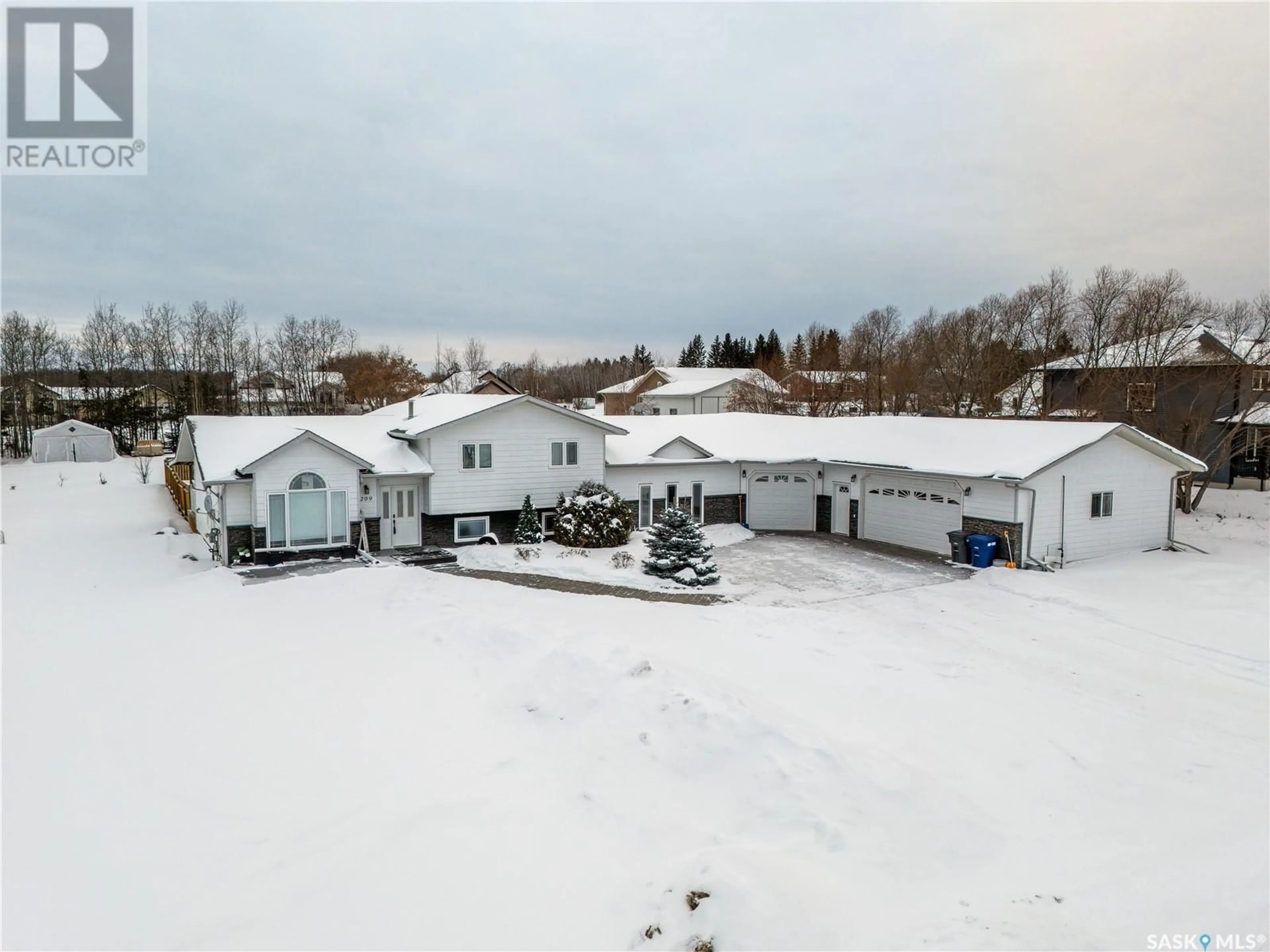 A pic from outside/outdoor area/front of a property/back of a property/a pic from drone, building for 209 1st STREET W, Pierceland Saskatchewan S0M2K0