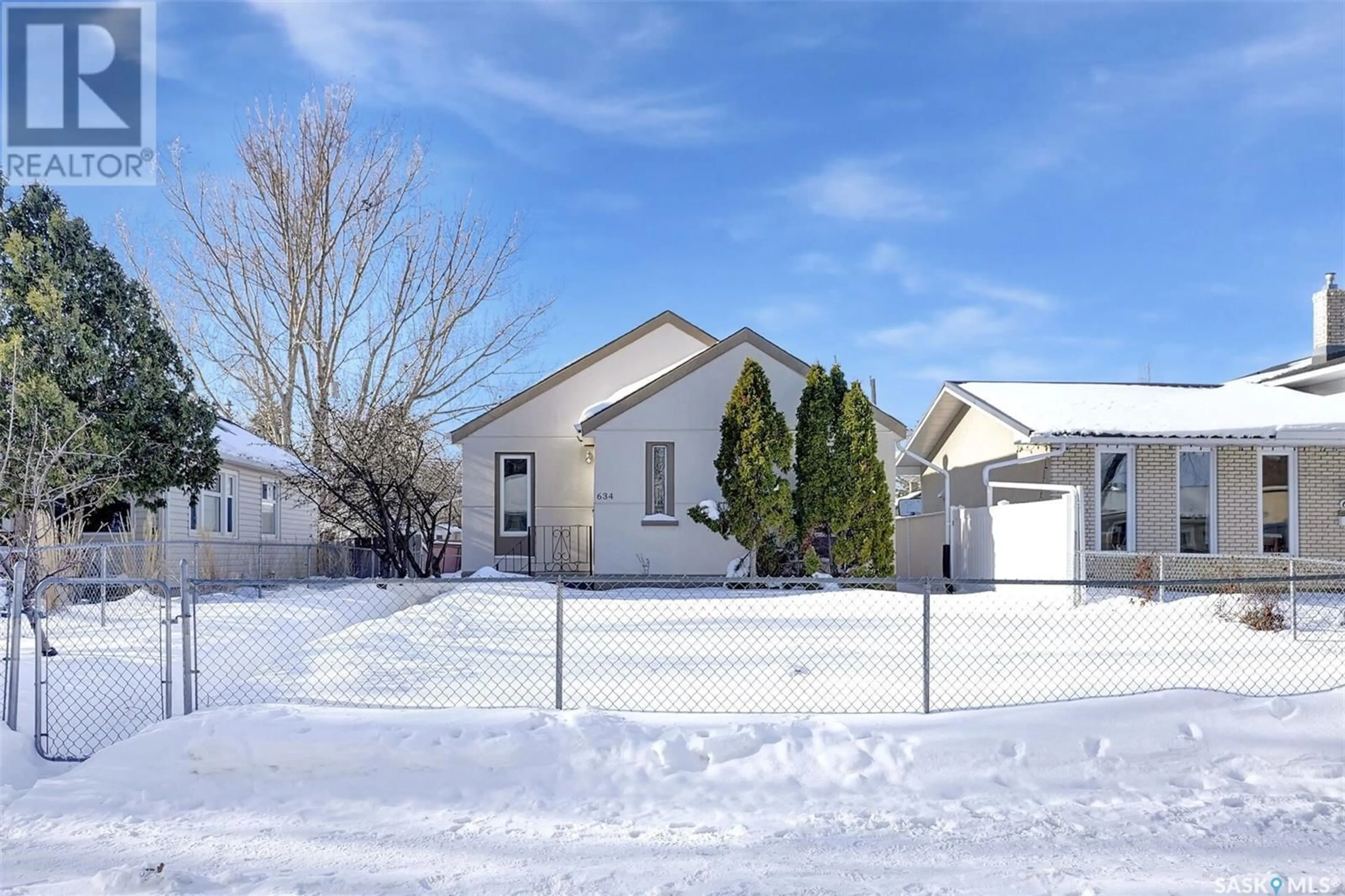 Home with vinyl exterior material, street for 634 Queen STREET, Regina Saskatchewan S4T4A1