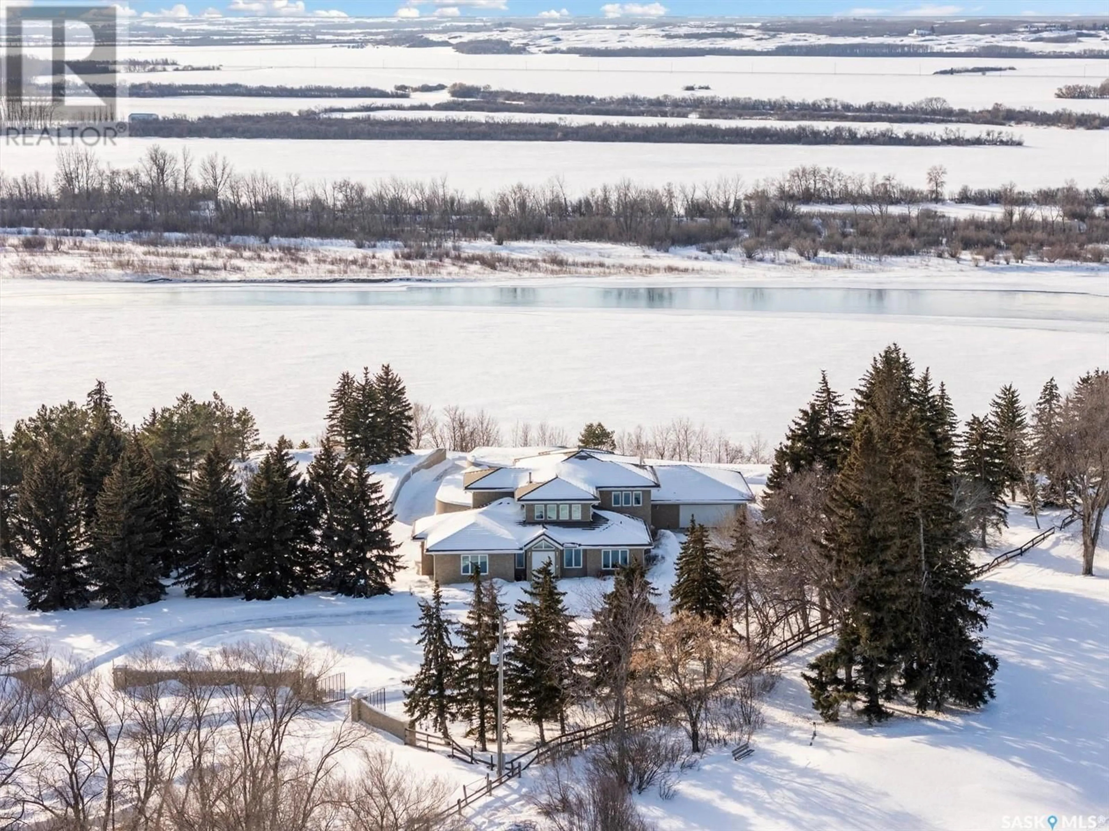 A pic from outside/outdoor area/front of a property/back of a property/a pic from drone, water/lake/river/ocean view for 9 Cherry LANE, Riverside Estates Saskatchewan S7T1A1