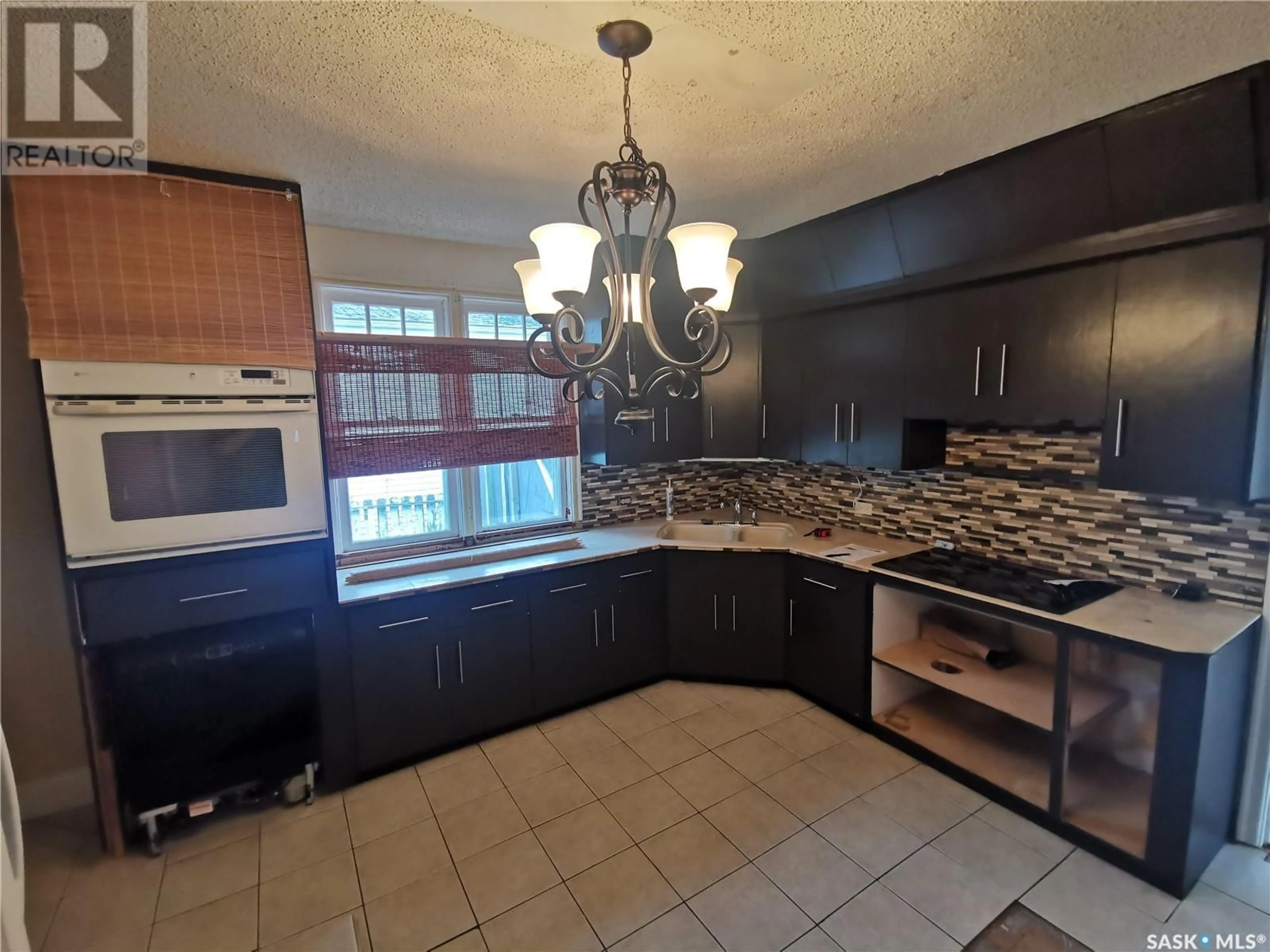 Open concept kitchen, ceramic/tile floor for 208 Horseshoe CRESCENT, Blaine Lake Saskatchewan S0J0J0