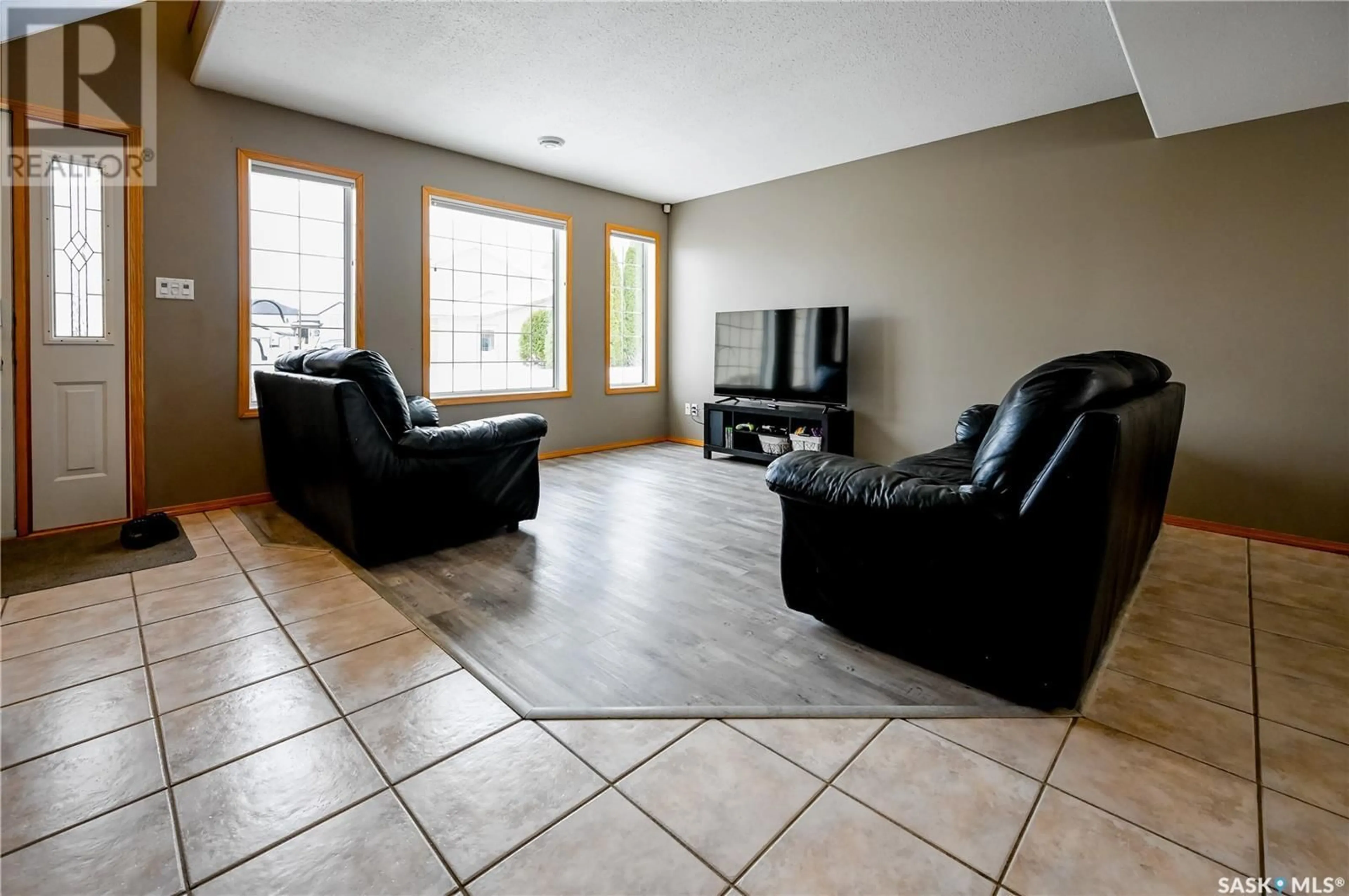 Living room with furniture, ceramic/tile floor for 7 Meagher PLACE, Prince Albert Saskatchewan S6X1C3