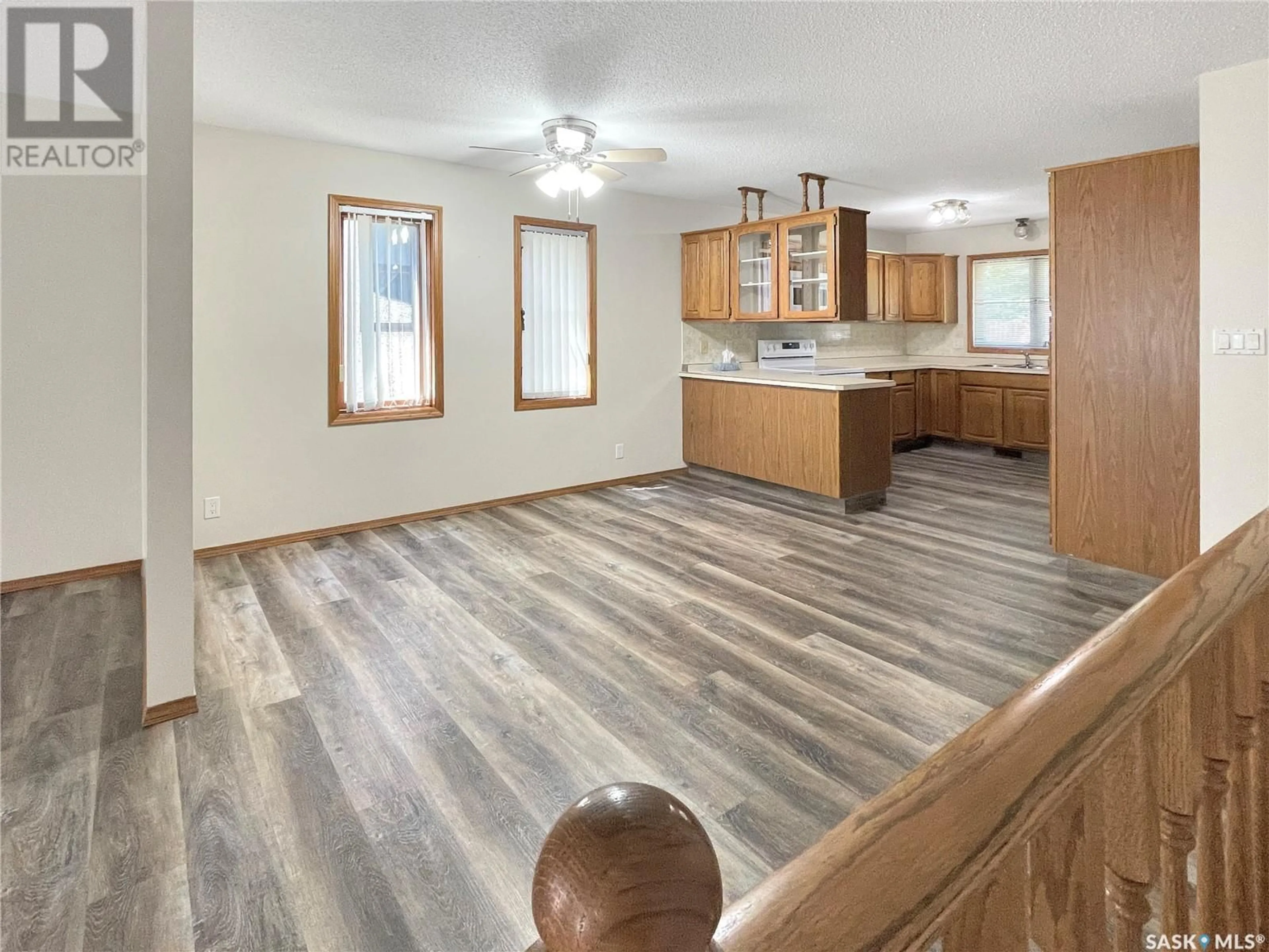 Open concept kitchen, wood/laminate floor for 349 Cypress DRIVE, Swift Current Saskatchewan S9H4V8