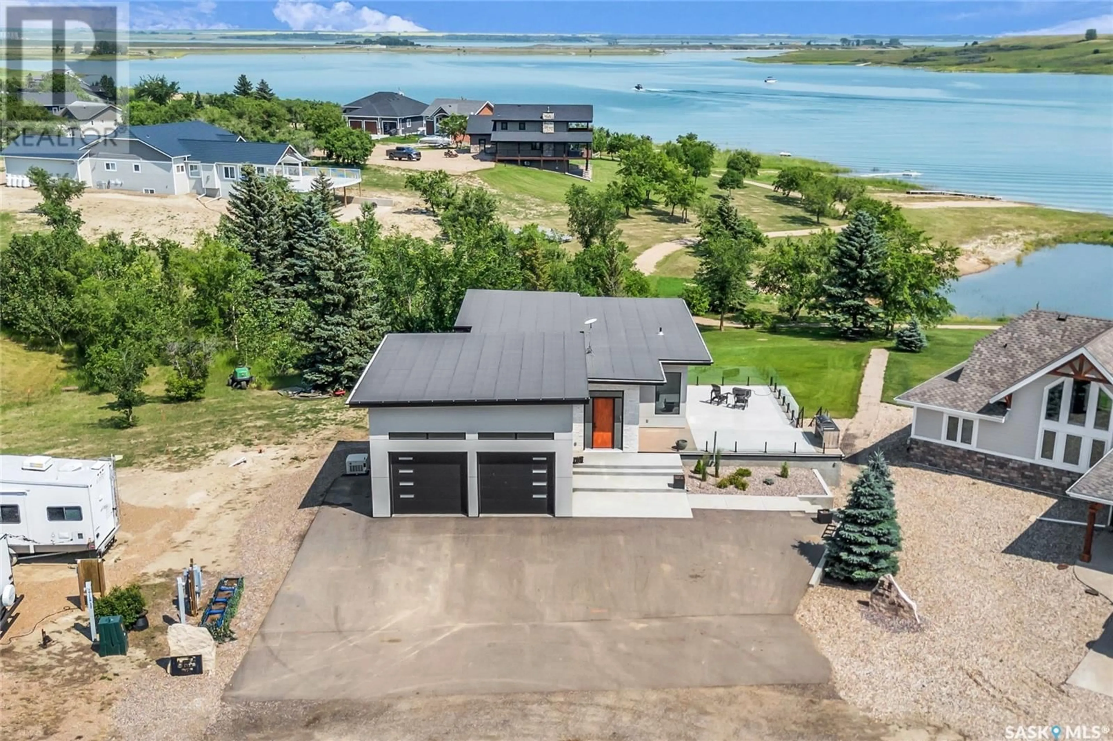 A pic from outside/outdoor area/front of a property/back of a property/a pic from drone, water/lake/river/ocean view for 11 Willow LANE, Diefenbaker Lake Saskatchewan S0L2E0