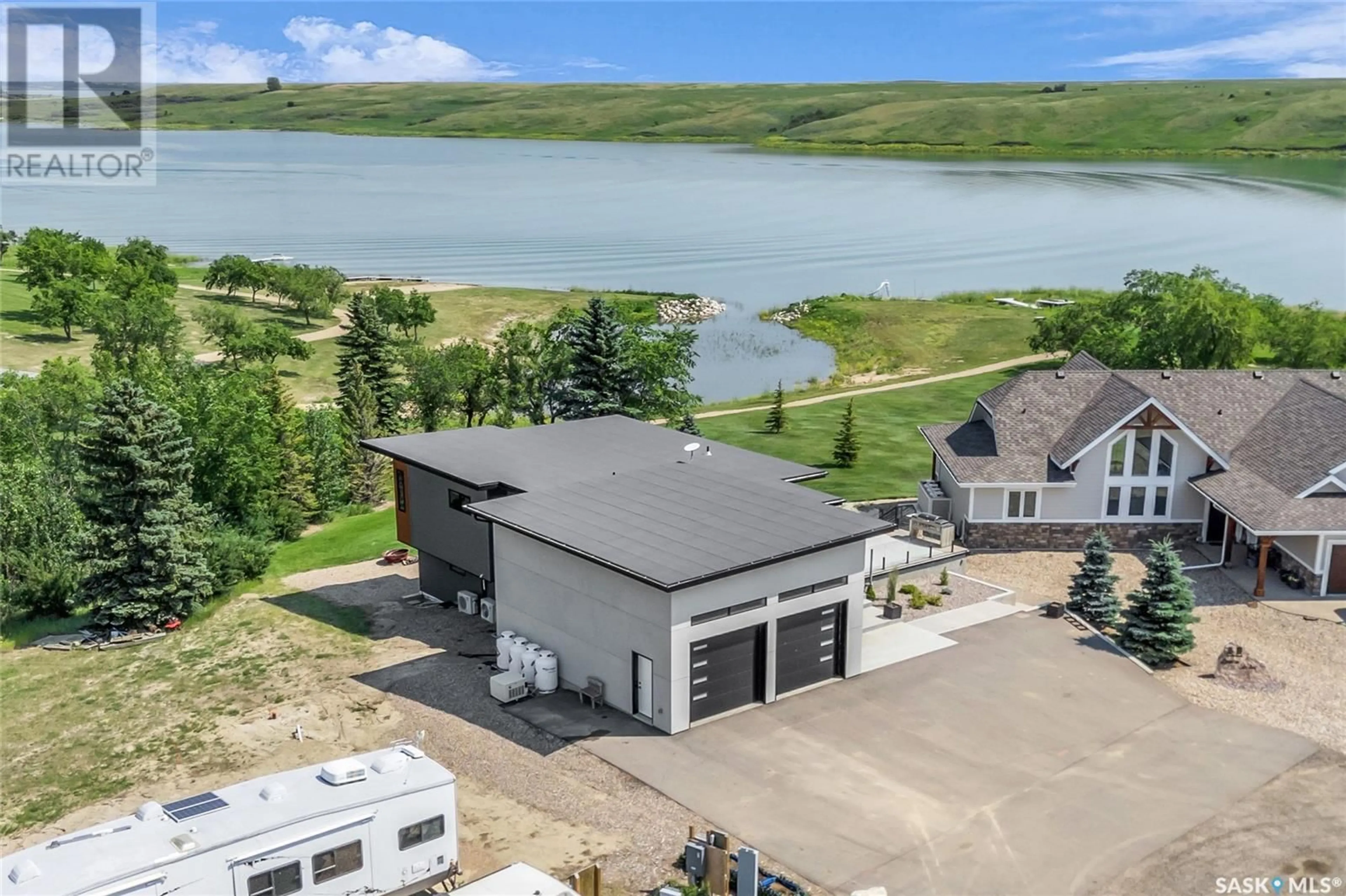 A pic from outside/outdoor area/front of a property/back of a property/a pic from drone, water/lake/river/ocean view for 11 Willow LANE, Diefenbaker Lake Saskatchewan S0L2E0