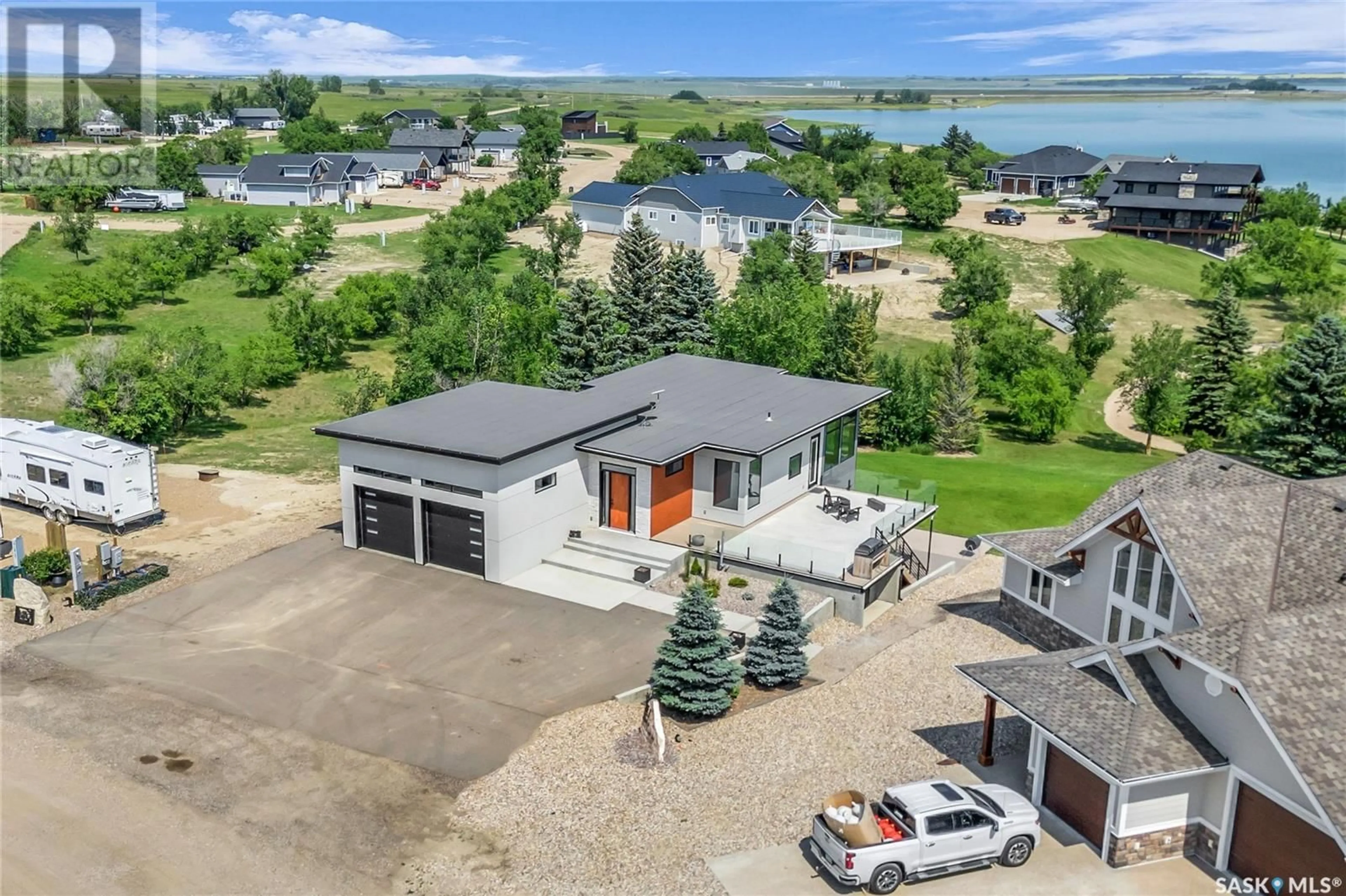 A pic from outside/outdoor area/front of a property/back of a property/a pic from drone, water/lake/river/ocean view for 11 Willow LANE, Diefenbaker Lake Saskatchewan S0L2E0