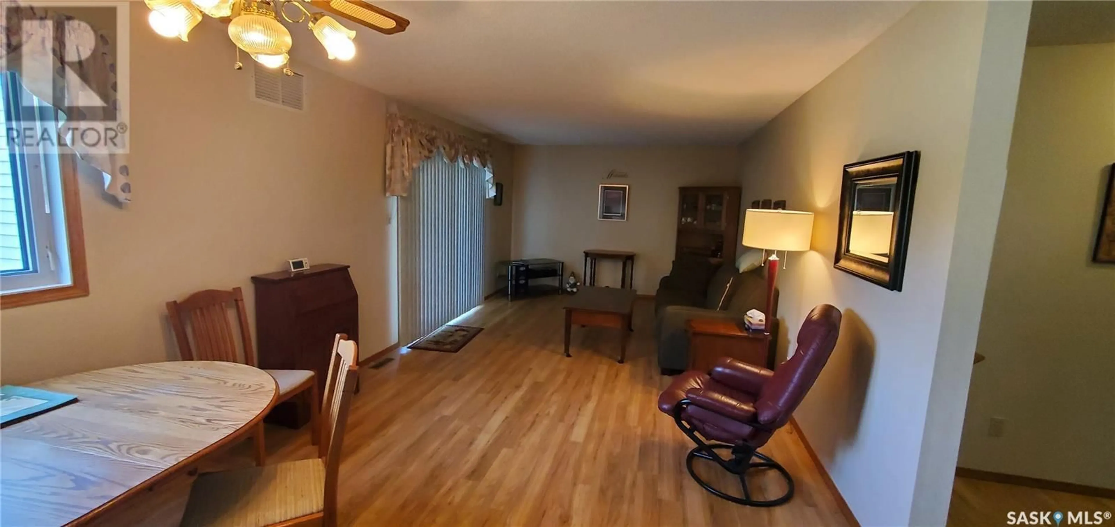 Living room with furniture, wood/laminate floor for 103 800 Hartney AVENUE, Weyburn Saskatchewan S4H0L8