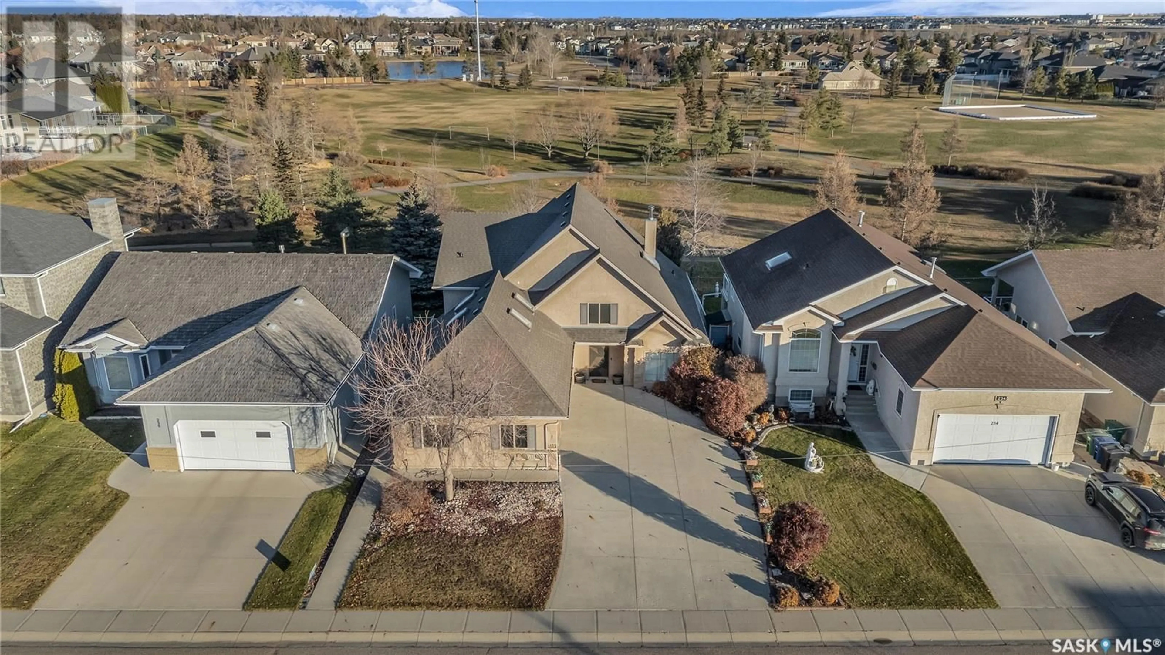 A pic from outside/outdoor area/front of a property/back of a property/a pic from drone, street for 230 Brookhurst CRESCENT, Saskatoon Saskatchewan S7V1C5