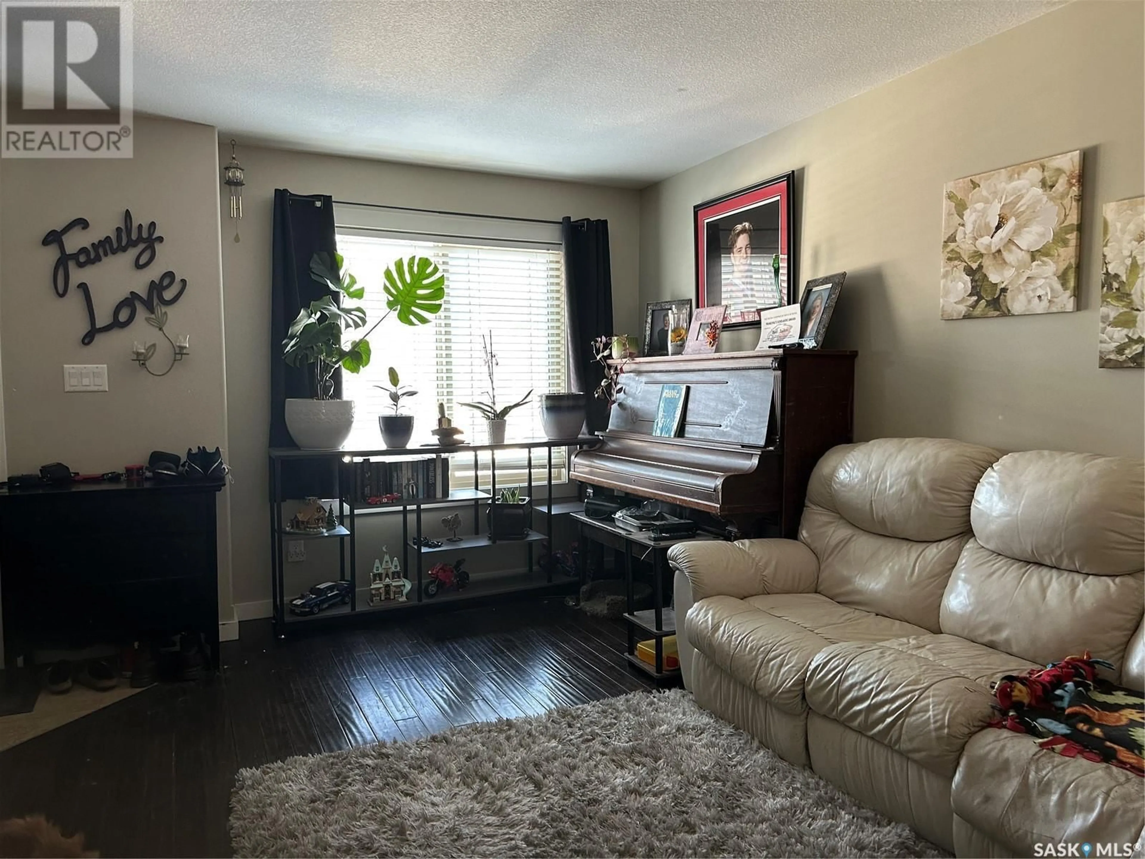 Living room with furniture, unknown for 18 880 5th STREET, Weyburn Saskatchewan S4H1A4