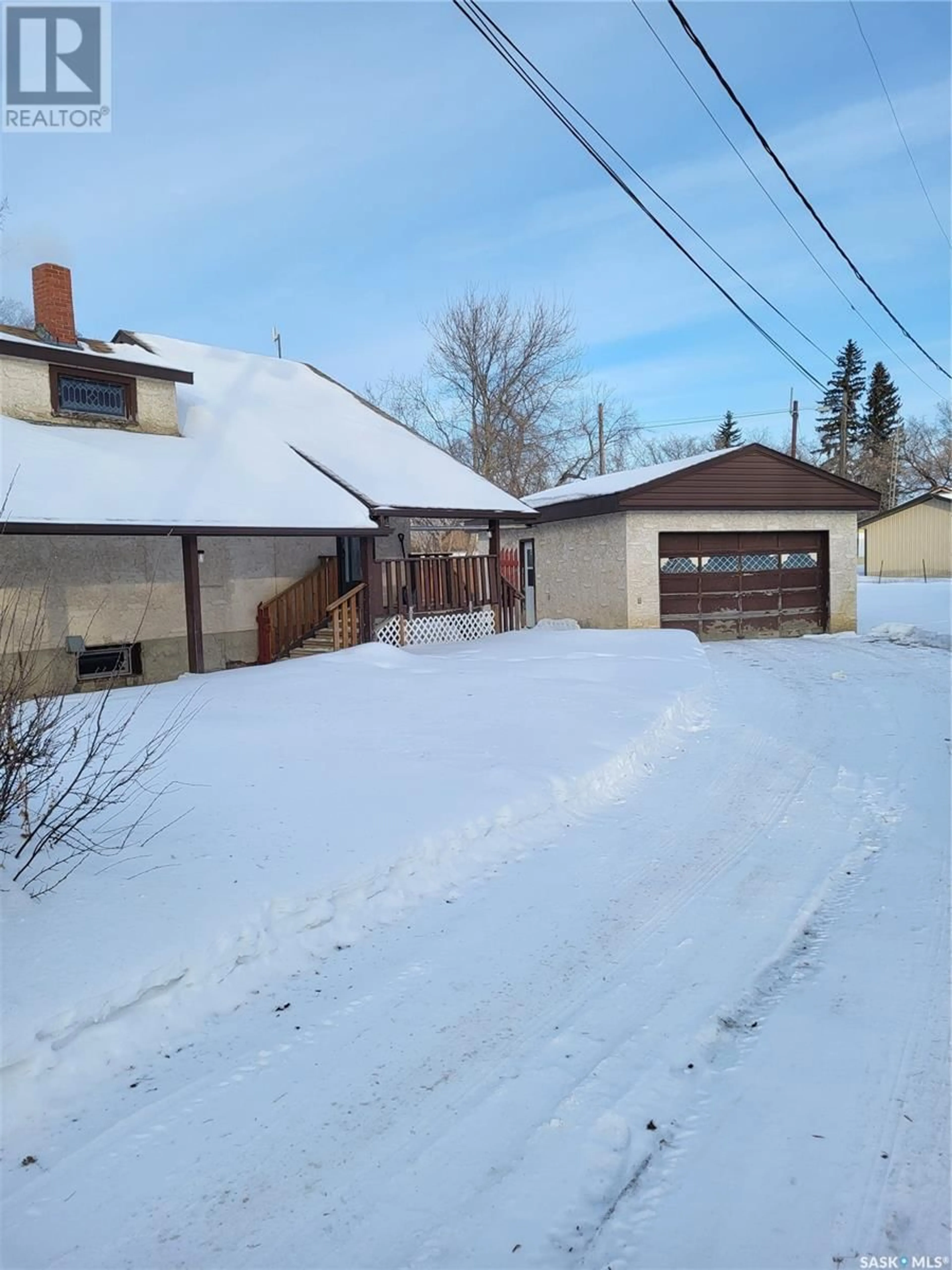 A pic from outside/outdoor area/front of a property/back of a property/a pic from drone, street for 206 1st STREET N, Domremy Saskatchewan S0K1G0