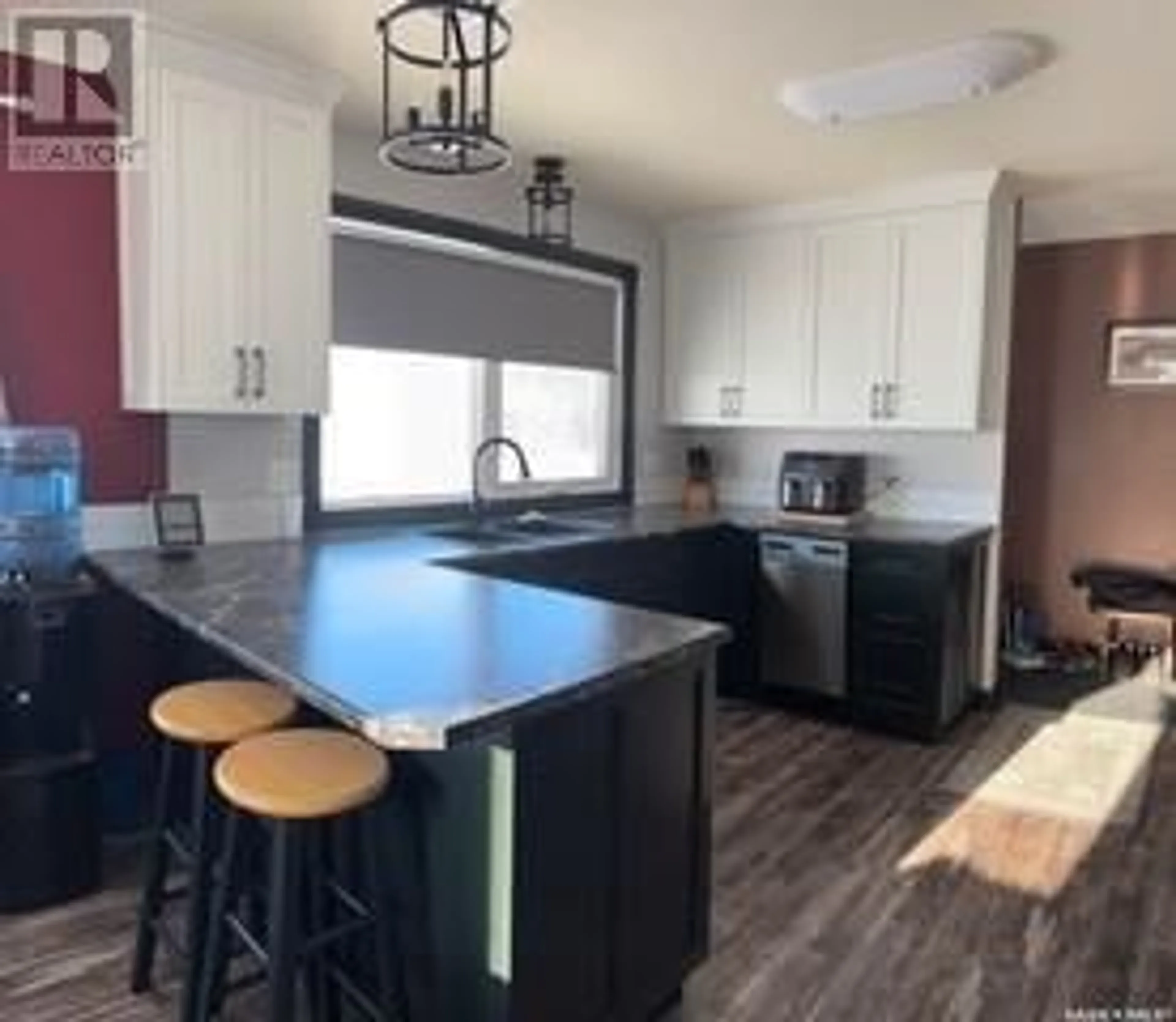 Open concept kitchen, wood/laminate floor for Burkart Acreage, Viscount Saskatchewan S0K4M0