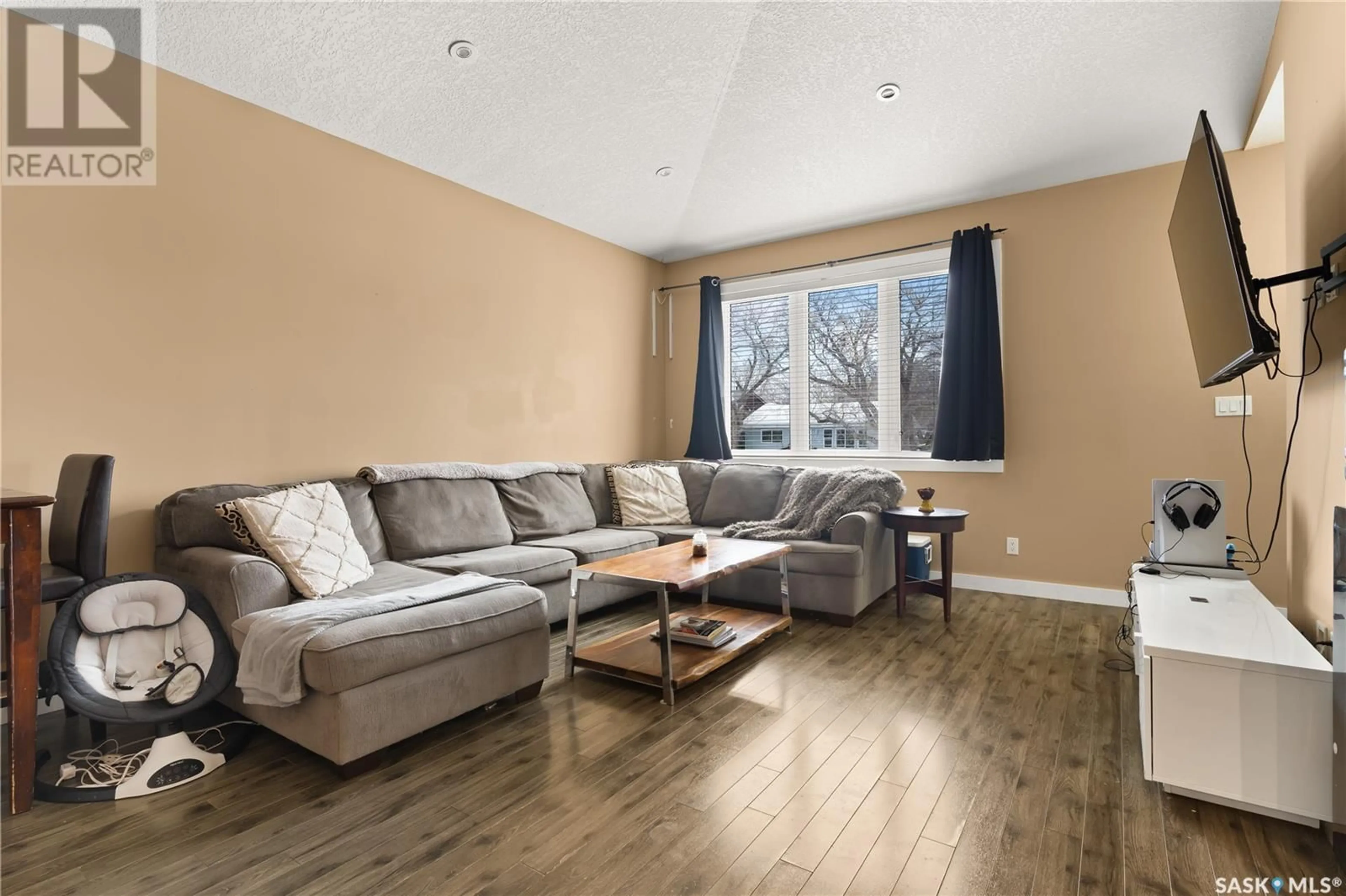 Living room with furniture, wood/laminate floor for 112 Osler STREET, Regina Saskatchewan S4R1V2