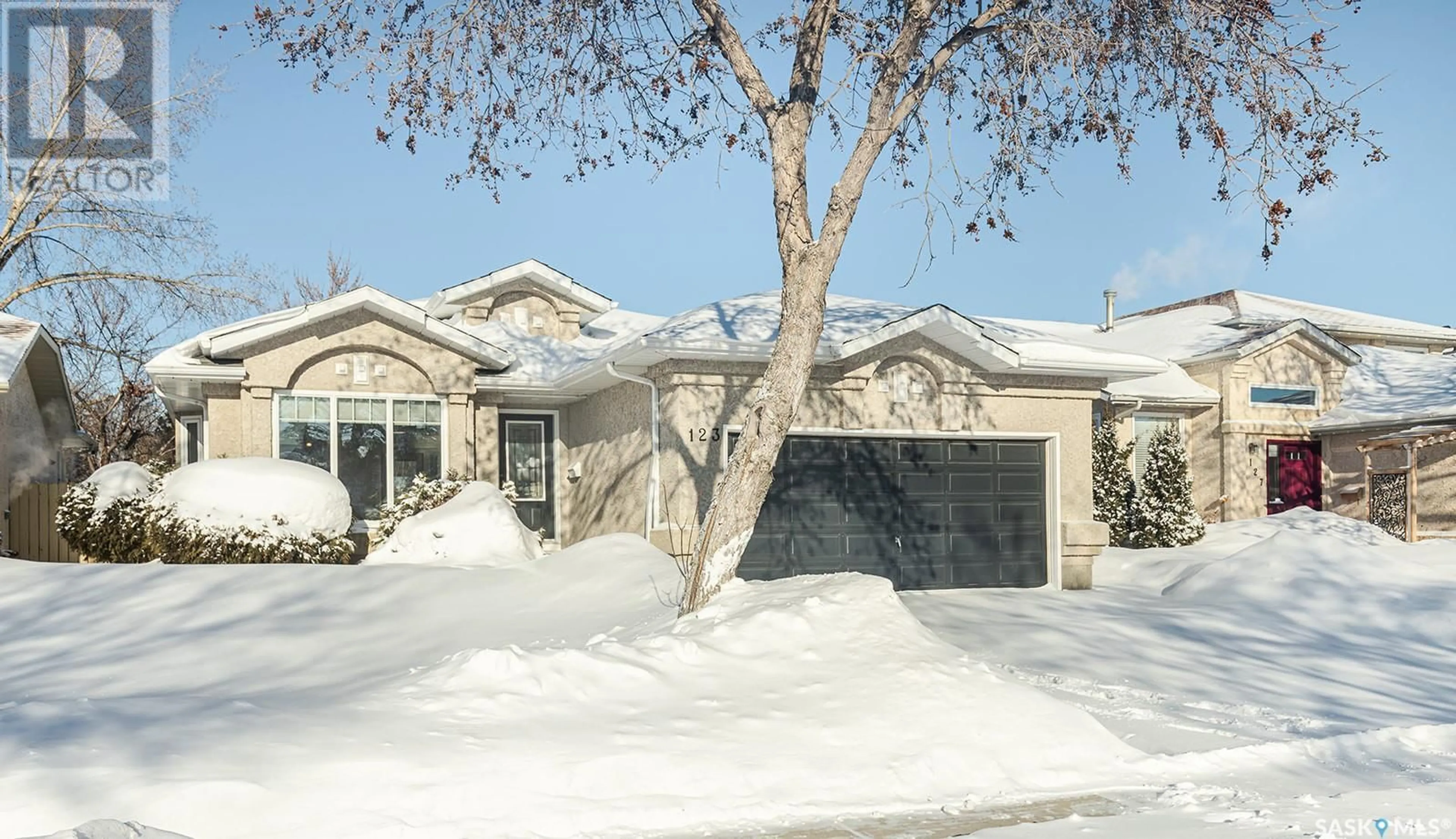 Home with vinyl exterior material, street for 123 Steiger CRESCENT, Saskatoon Saskatchewan S7N4K1