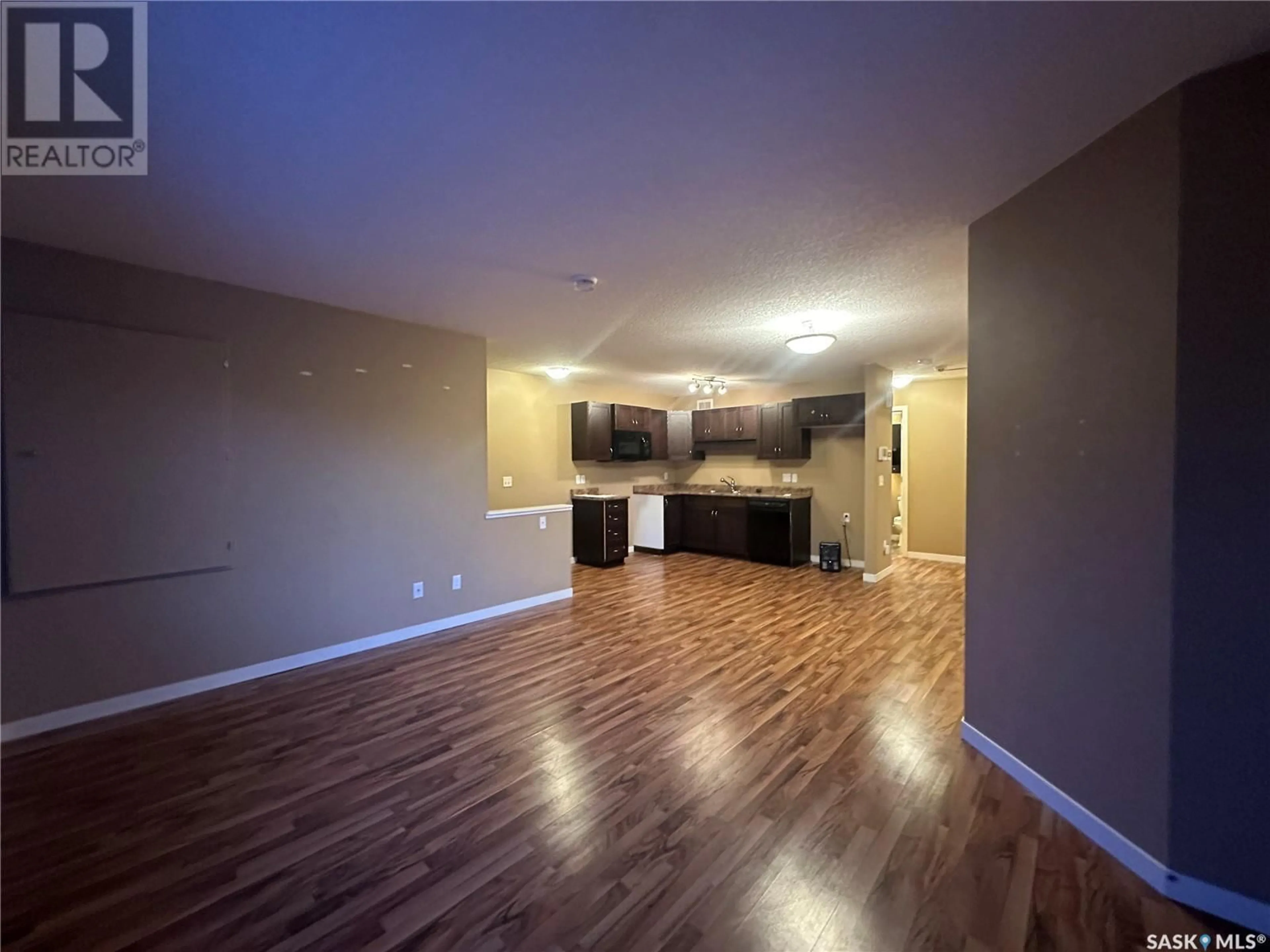 Open concept kitchen, wood/laminate floor for 90 5529 Blake CRESCENT, Regina Saskatchewan S4X0J1