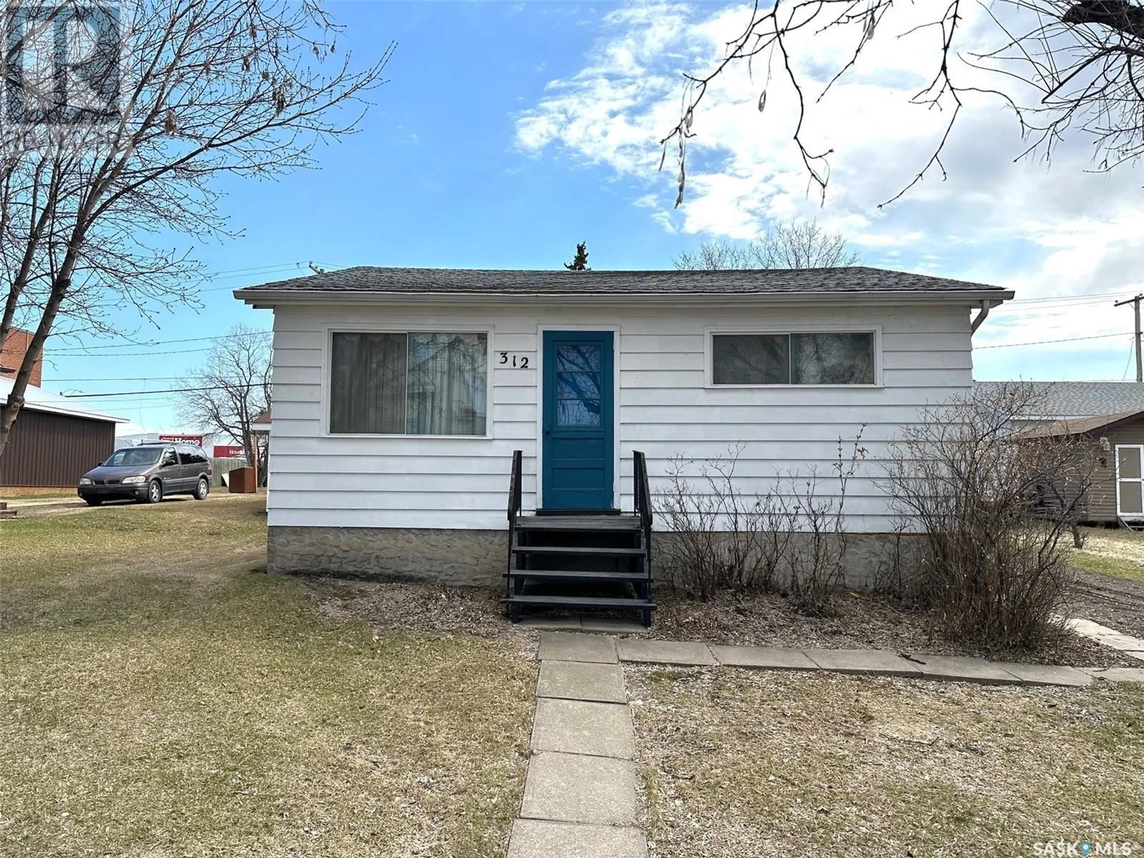 Home with vinyl exterior material, street for 312 Main STREET, Hudson Bay Saskatchewan S0E0Y0