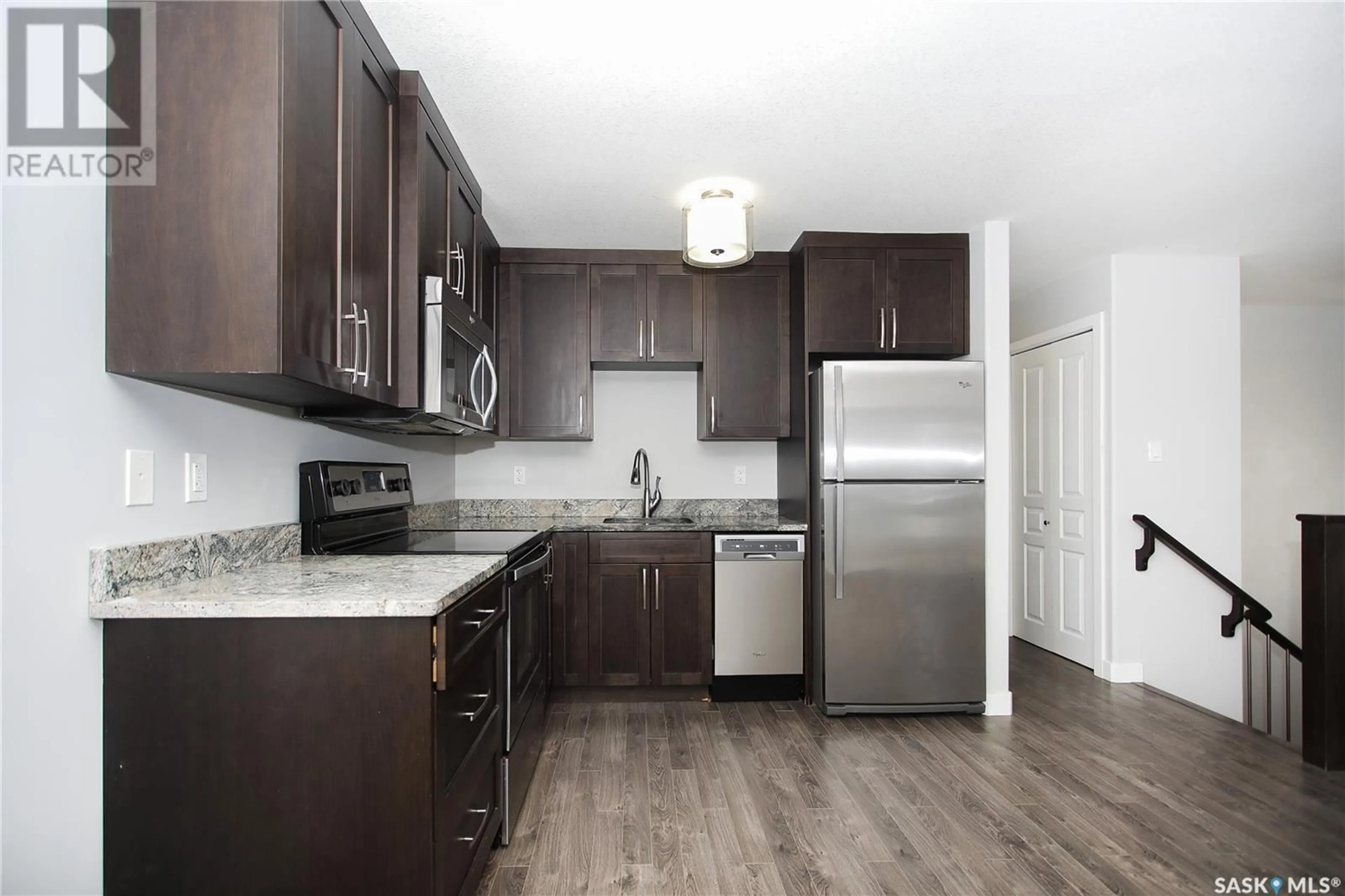 Standard kitchen, wood/laminate floor for 401 2703 Spadina CRESCENT E, Saskatoon Saskatchewan S7K6P8