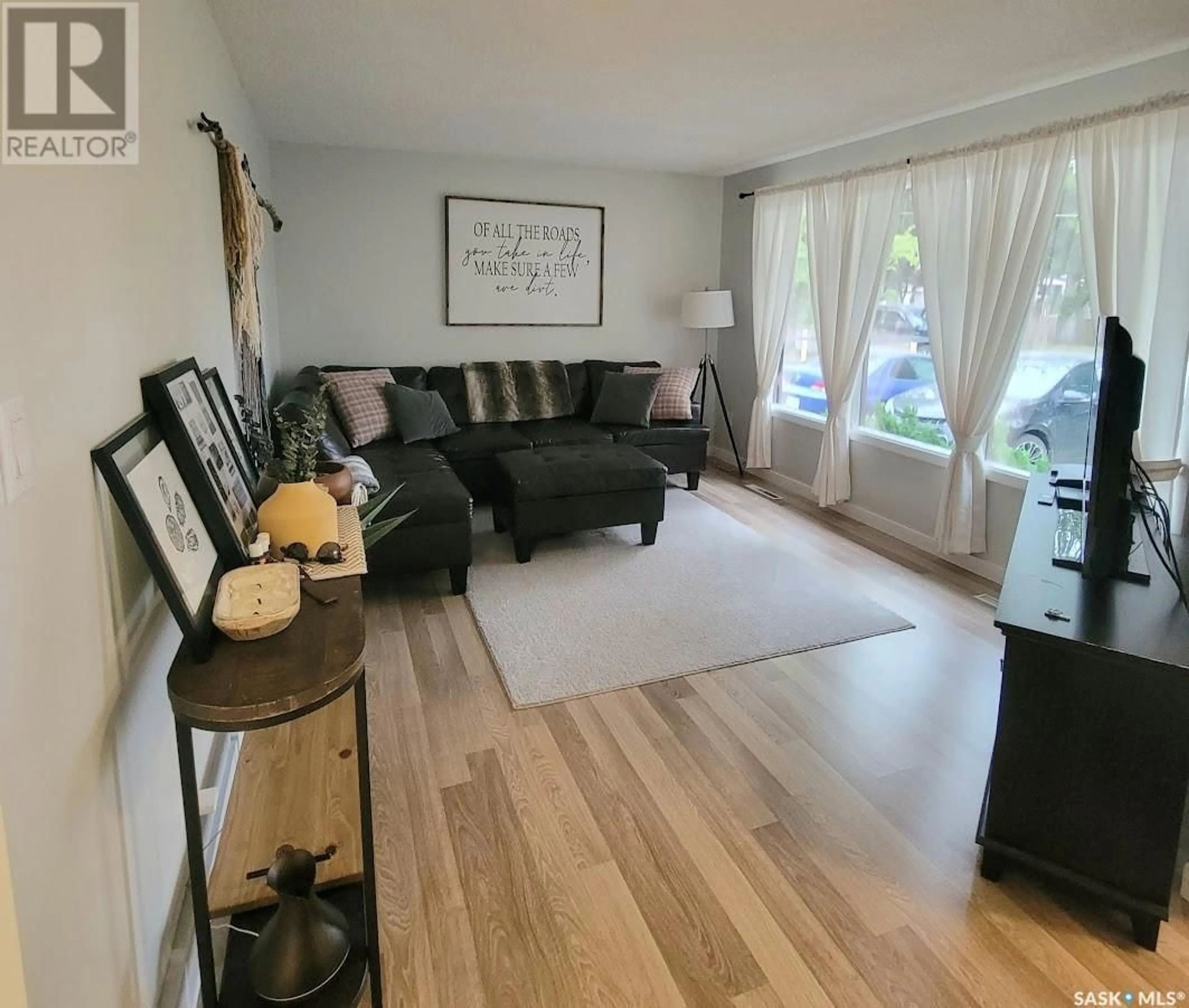 Living room with furniture, wood/laminate floor for 145 JOHNSTON CRESCENT, Canora Saskatchewan S0A0L0