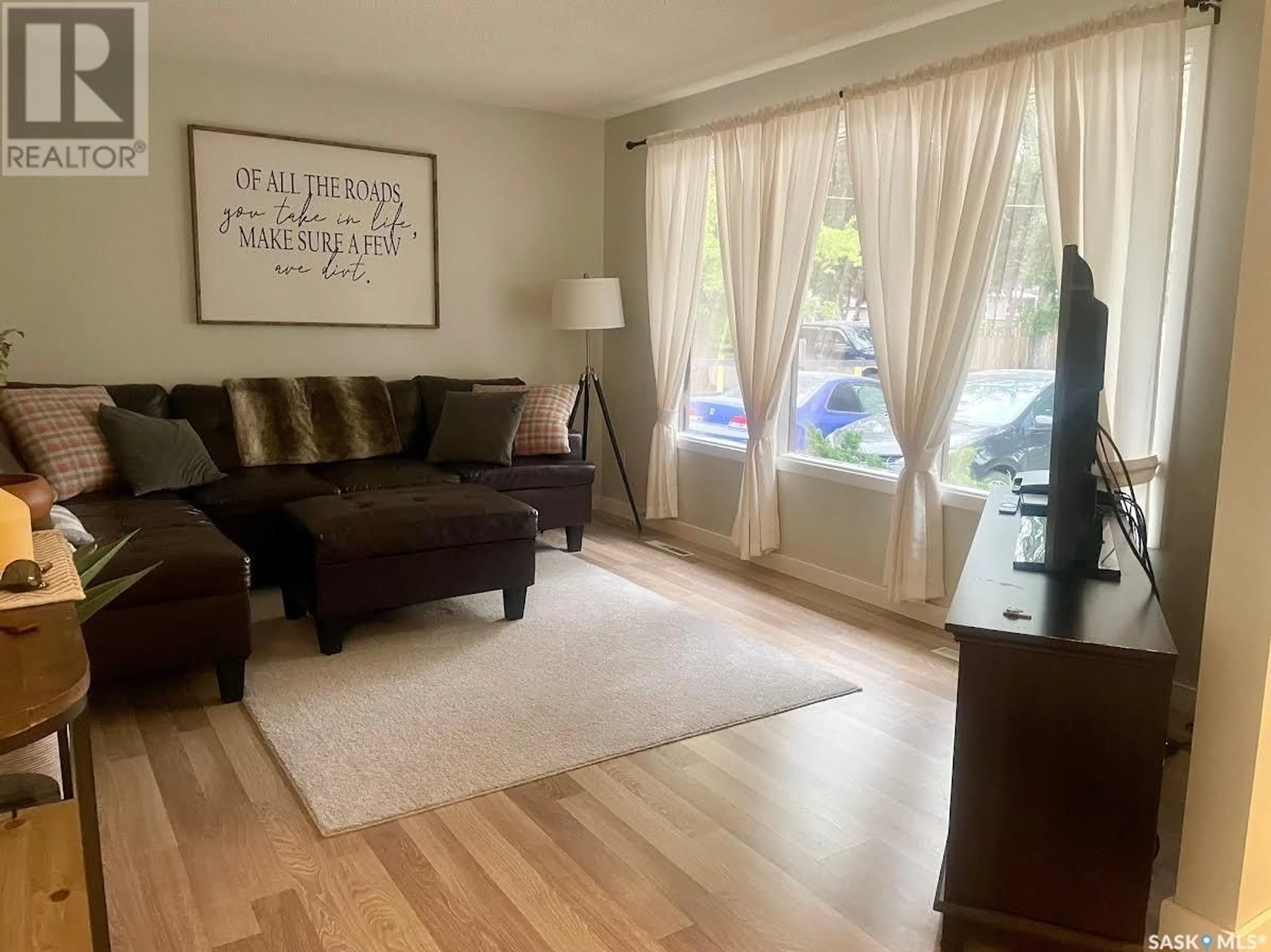 Living room with furniture, wood/laminate floor for 145 JOHNSTON CRESCENT, Canora Saskatchewan S0A0L0