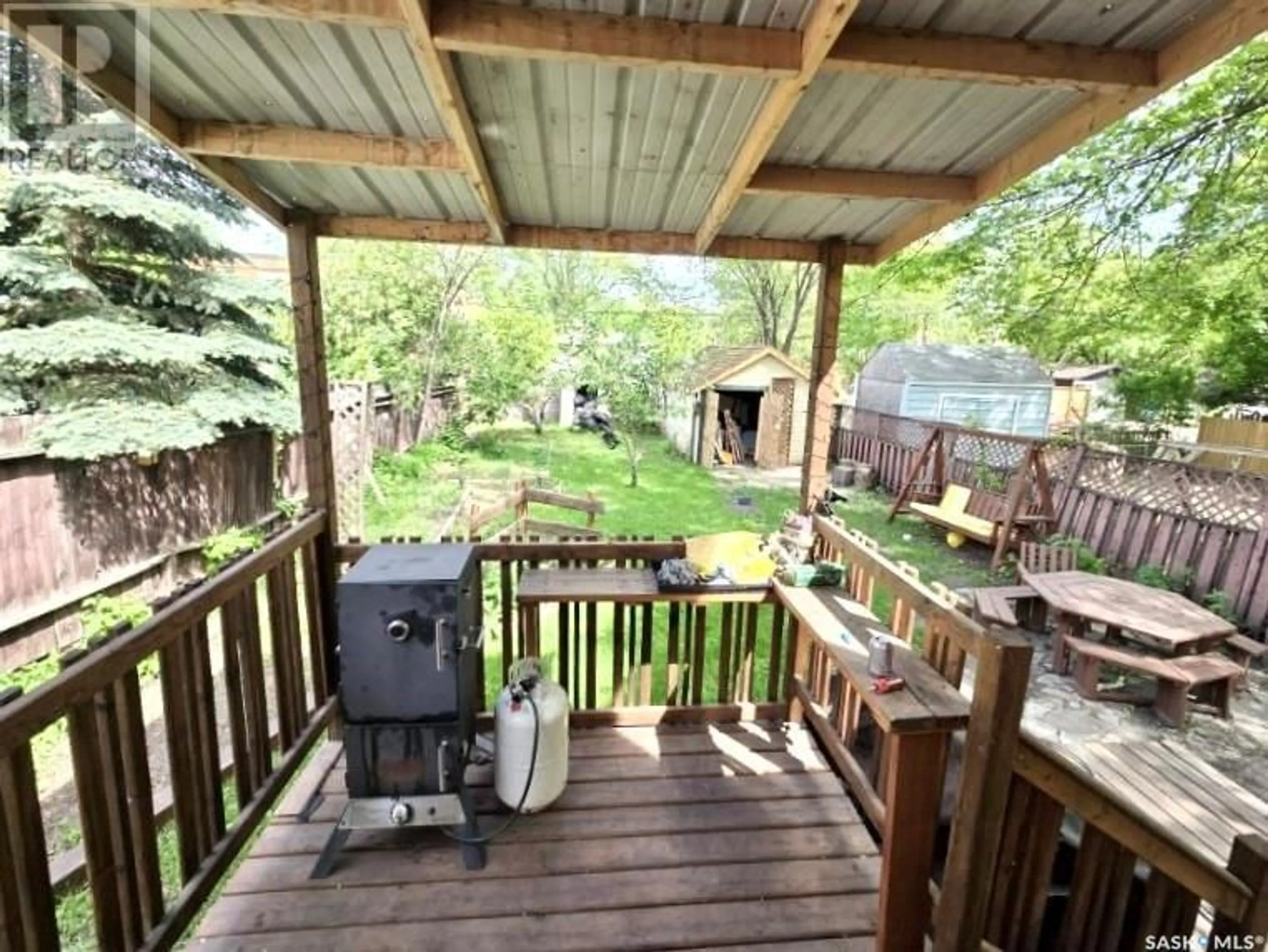 Patio, forest/trees view for 234 F AVENUE N, Saskatoon Saskatchewan S7L1W1