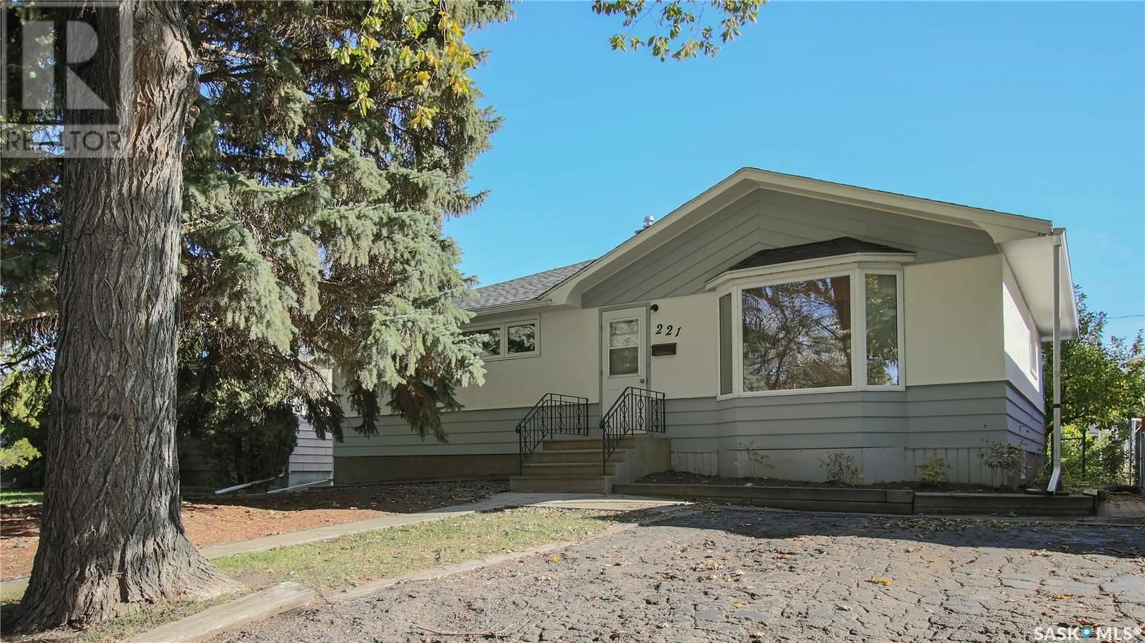 Home with vinyl exterior material, street for 221 Lorne STREET, Regina Saskatchewan S4R2J1