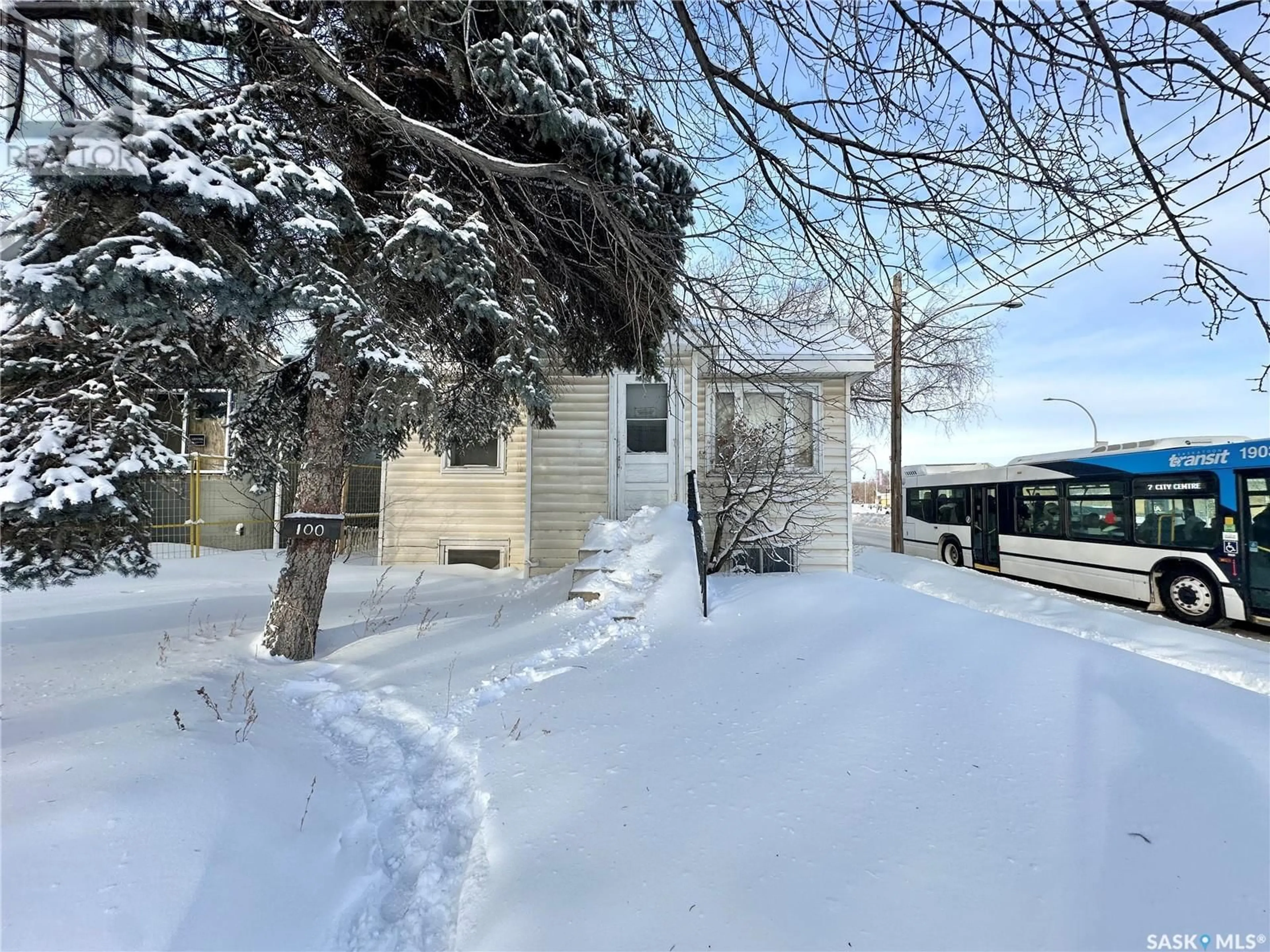 A pic from outside/outdoor area/front of a property/back of a property/a pic from drone, street for 100 32nd STREET W, Saskatoon Saskatchewan S7L0S1