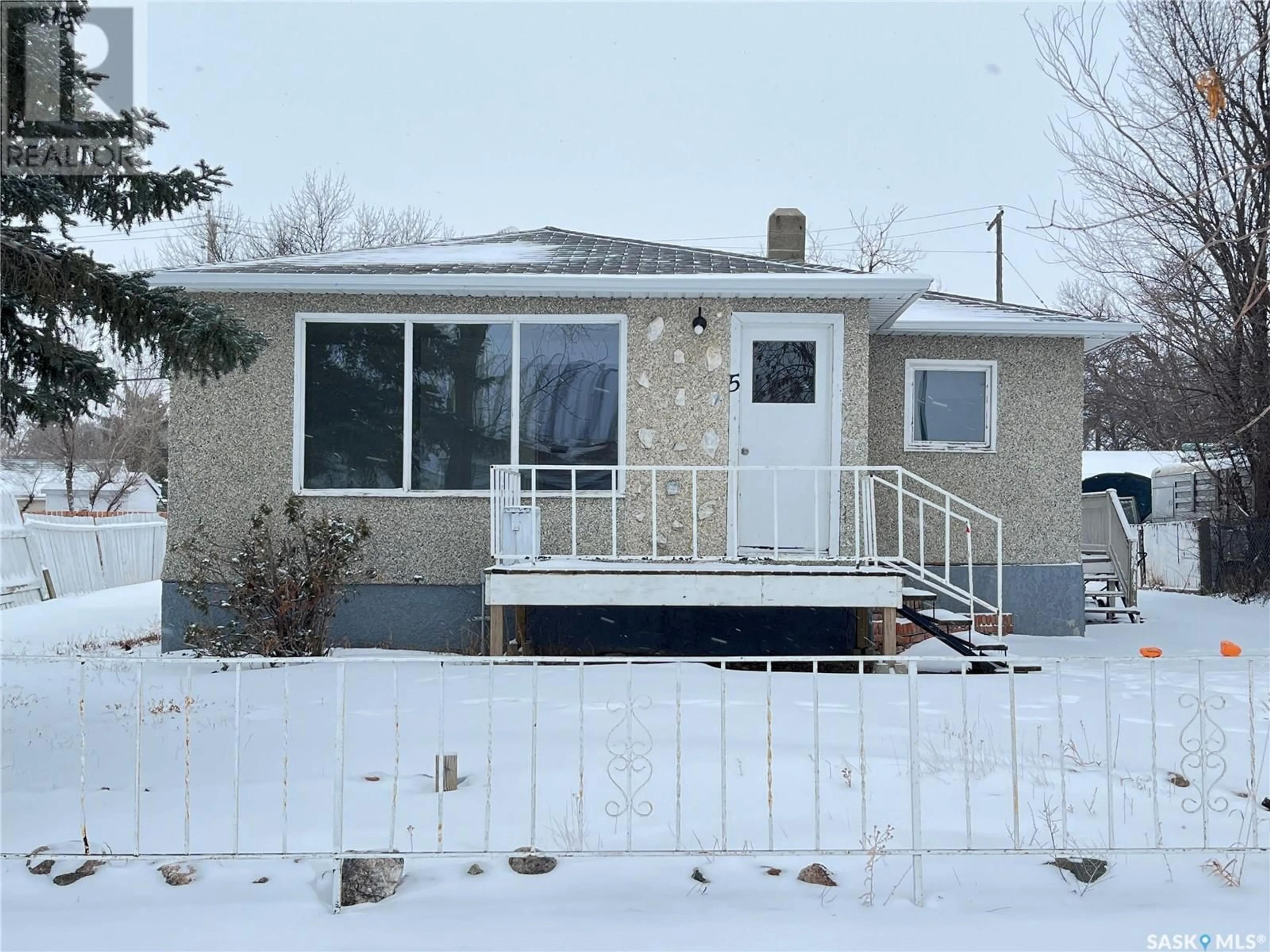 Home with vinyl exterior material, street for 5 Pacific AVENUE, Maple Creek Saskatchewan S0N1N0