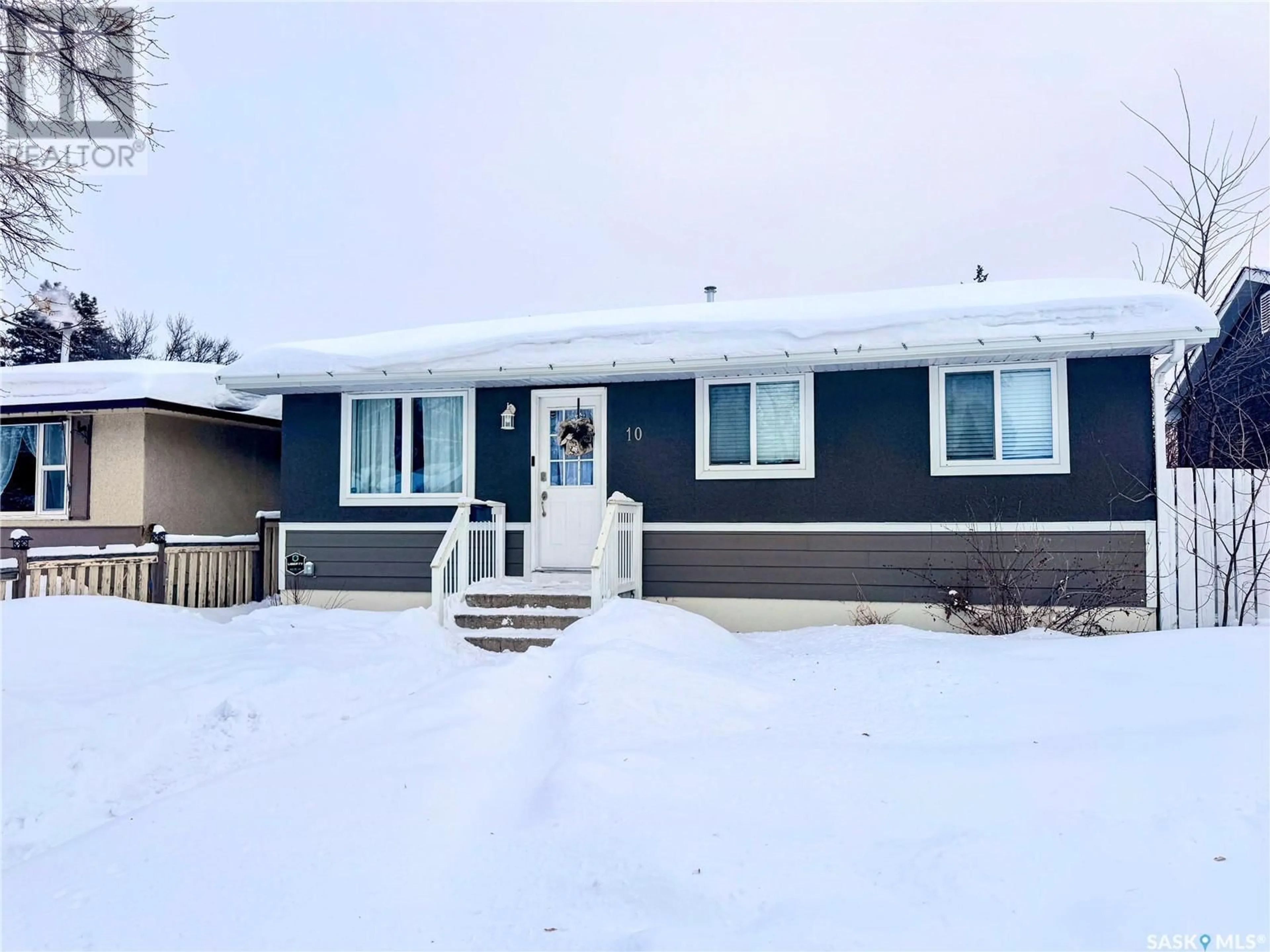 Home with vinyl exterior material, street for 10 Cartier CRESCENT, Saskatoon Saskatchewan S7L4L7