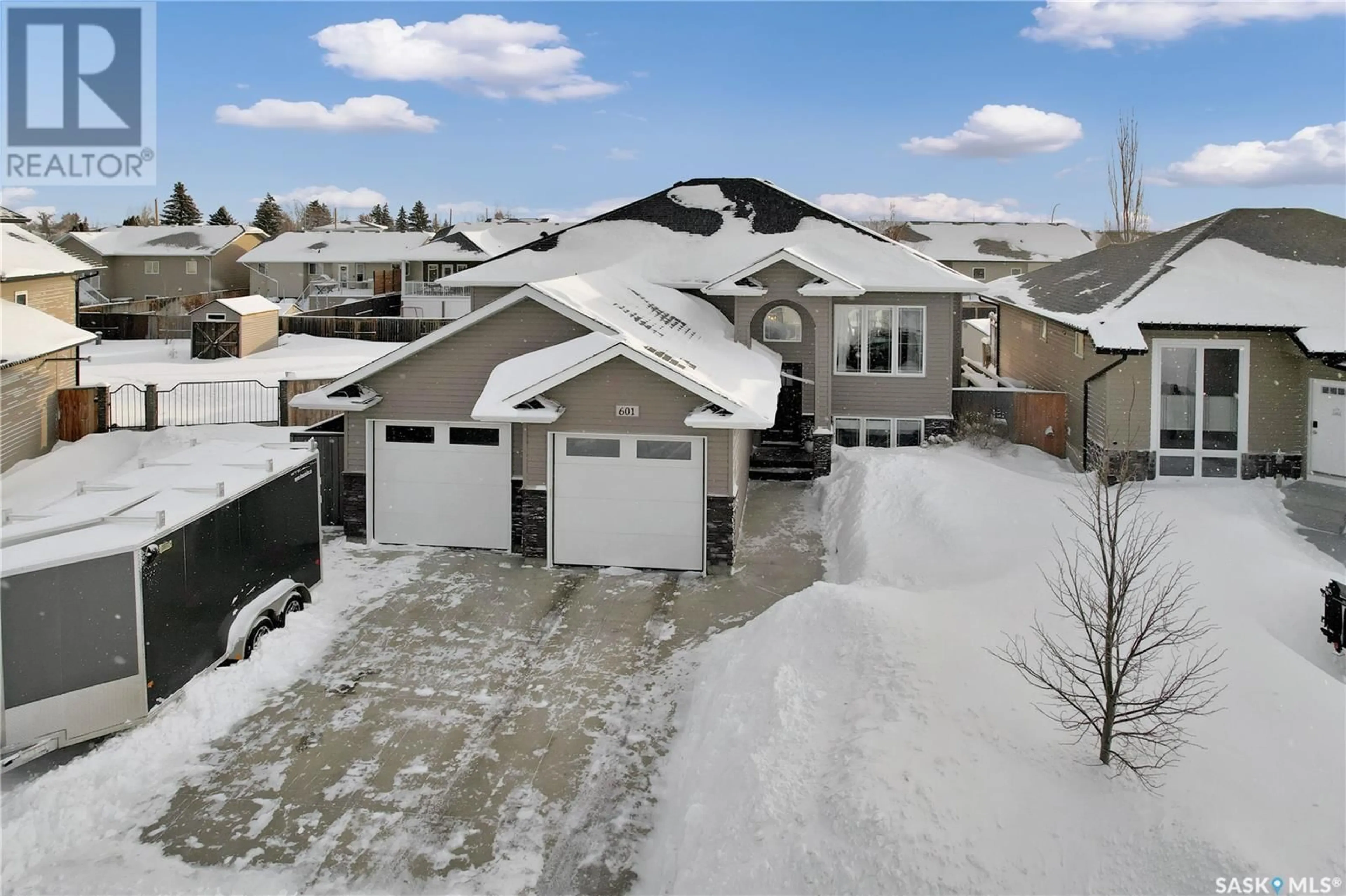 A pic from outside/outdoor area/front of a property/back of a property/a pic from drone, street for 601 Quessy DRIVE, Martensville Saskatchewan S0K0A2