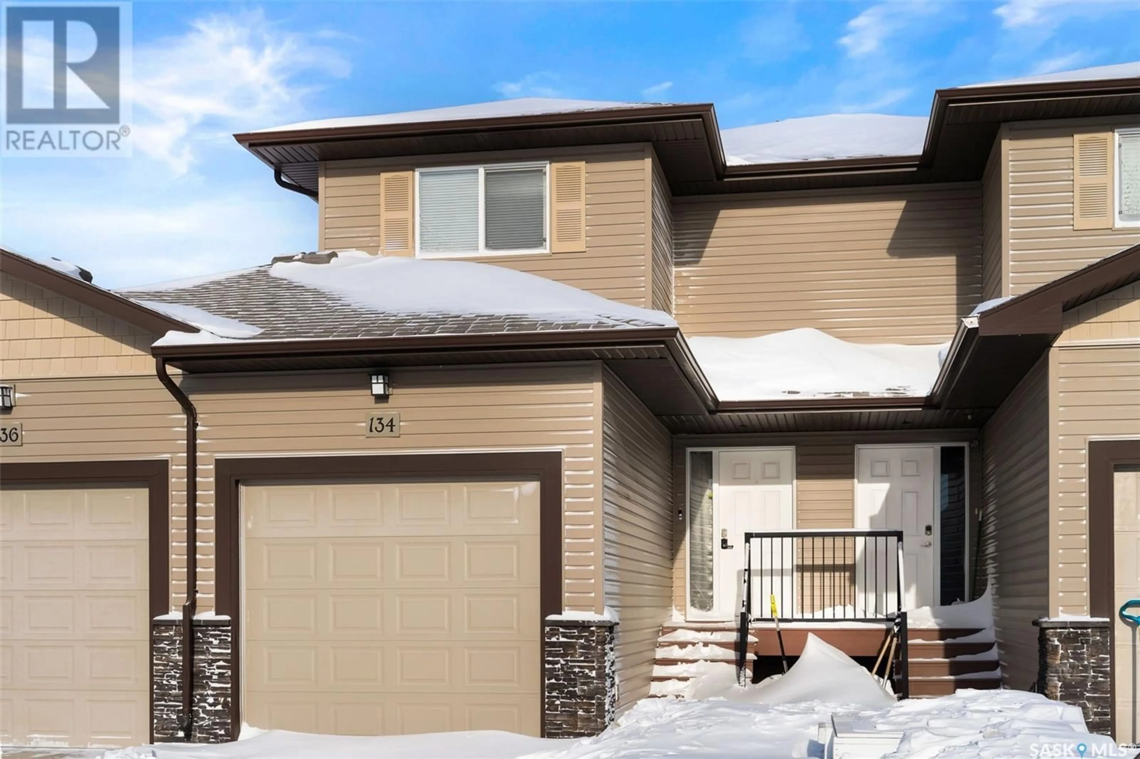 Home with brick exterior material, street for 134 Plains CIRCLE, Pilot Butte Saskatchewan S0G3Z0