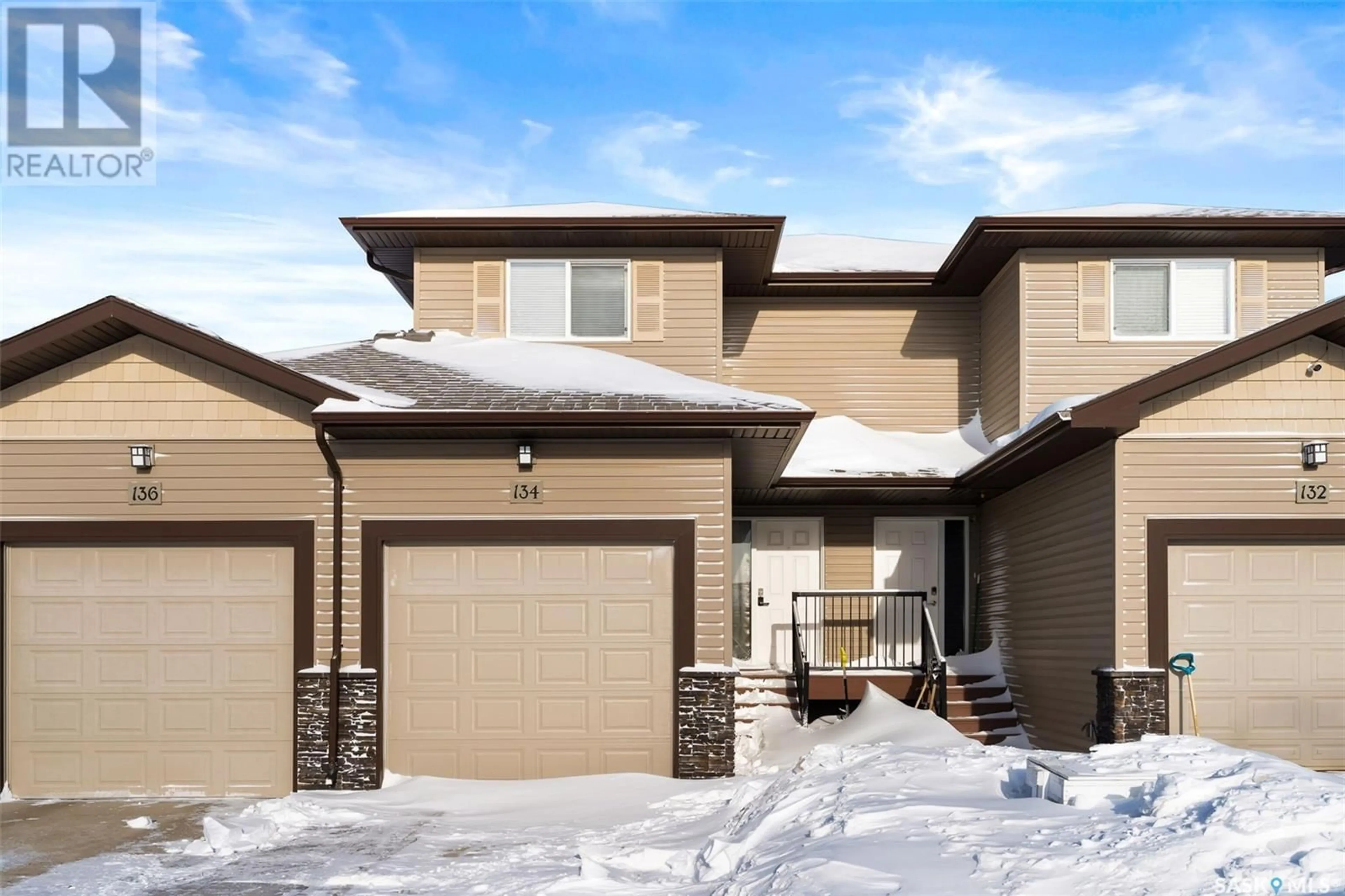 Home with brick exterior material, street for 134 Plains CIRCLE, Pilot Butte Saskatchewan S0G3Z0