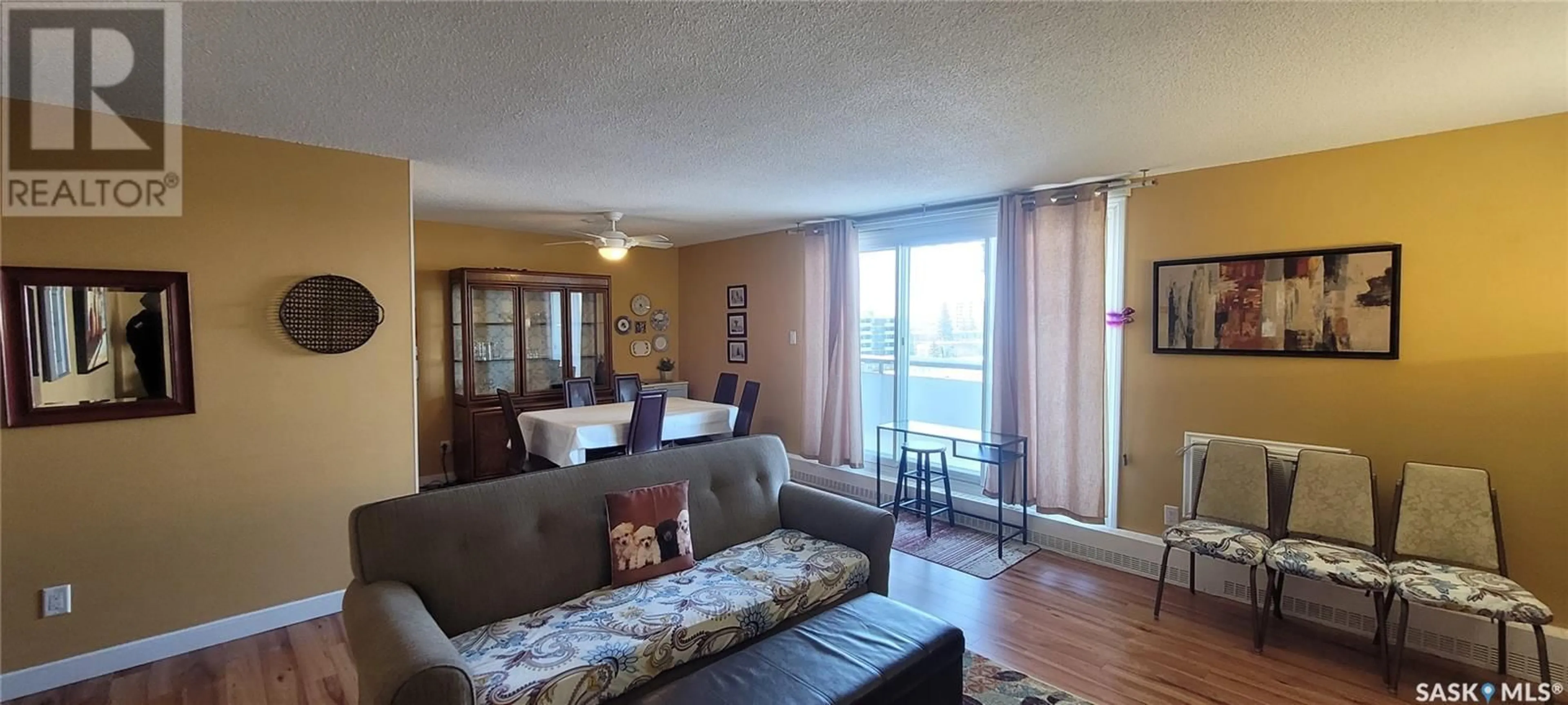 Living room with furniture, wood/laminate floor for 608 4615 Rae STREET, Regina Saskatchewan S4S3B2