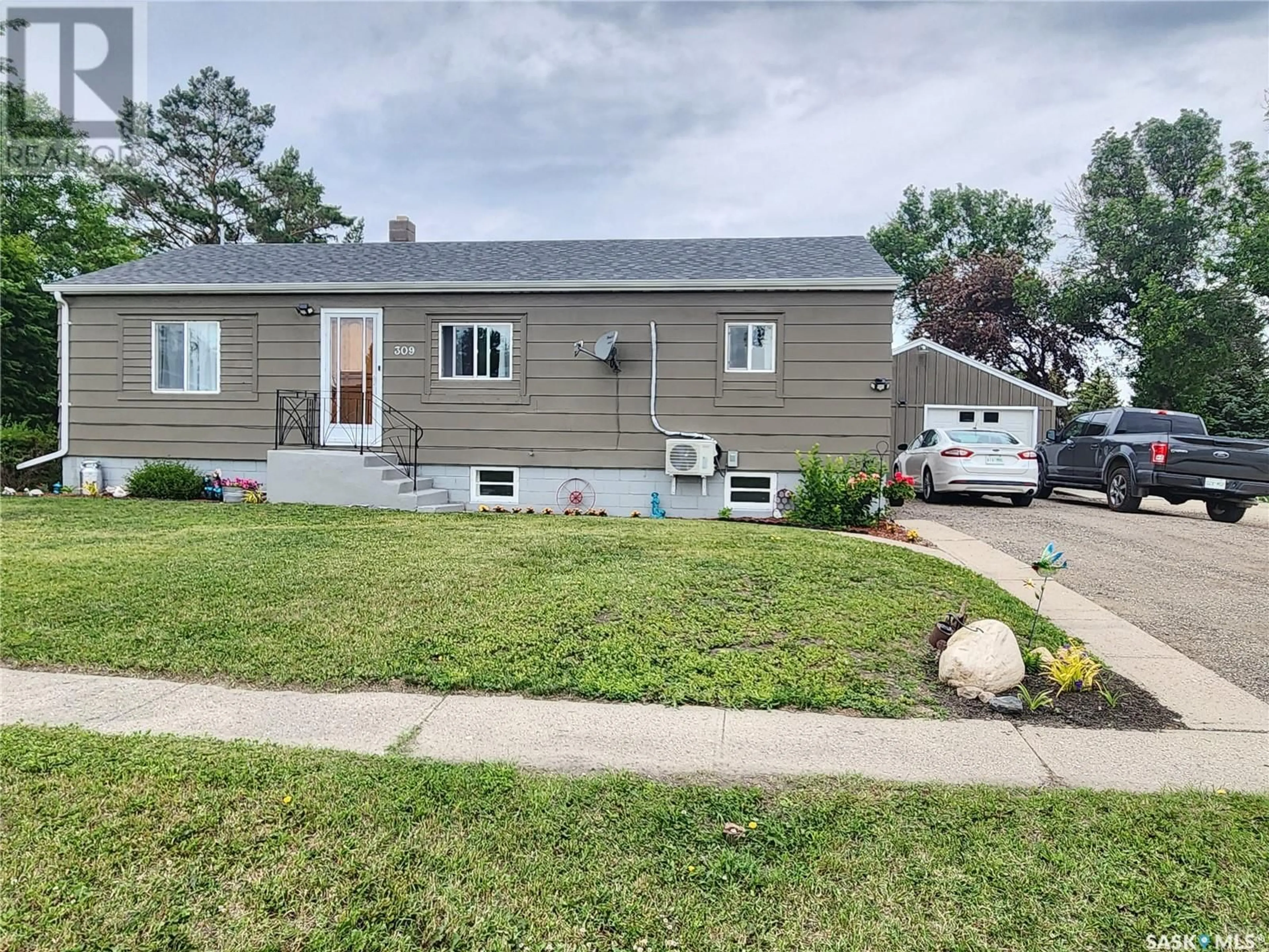 Home with vinyl exterior material, street for 309 BROME STREET, Yellow Grass Saskatchewan S0G5J0