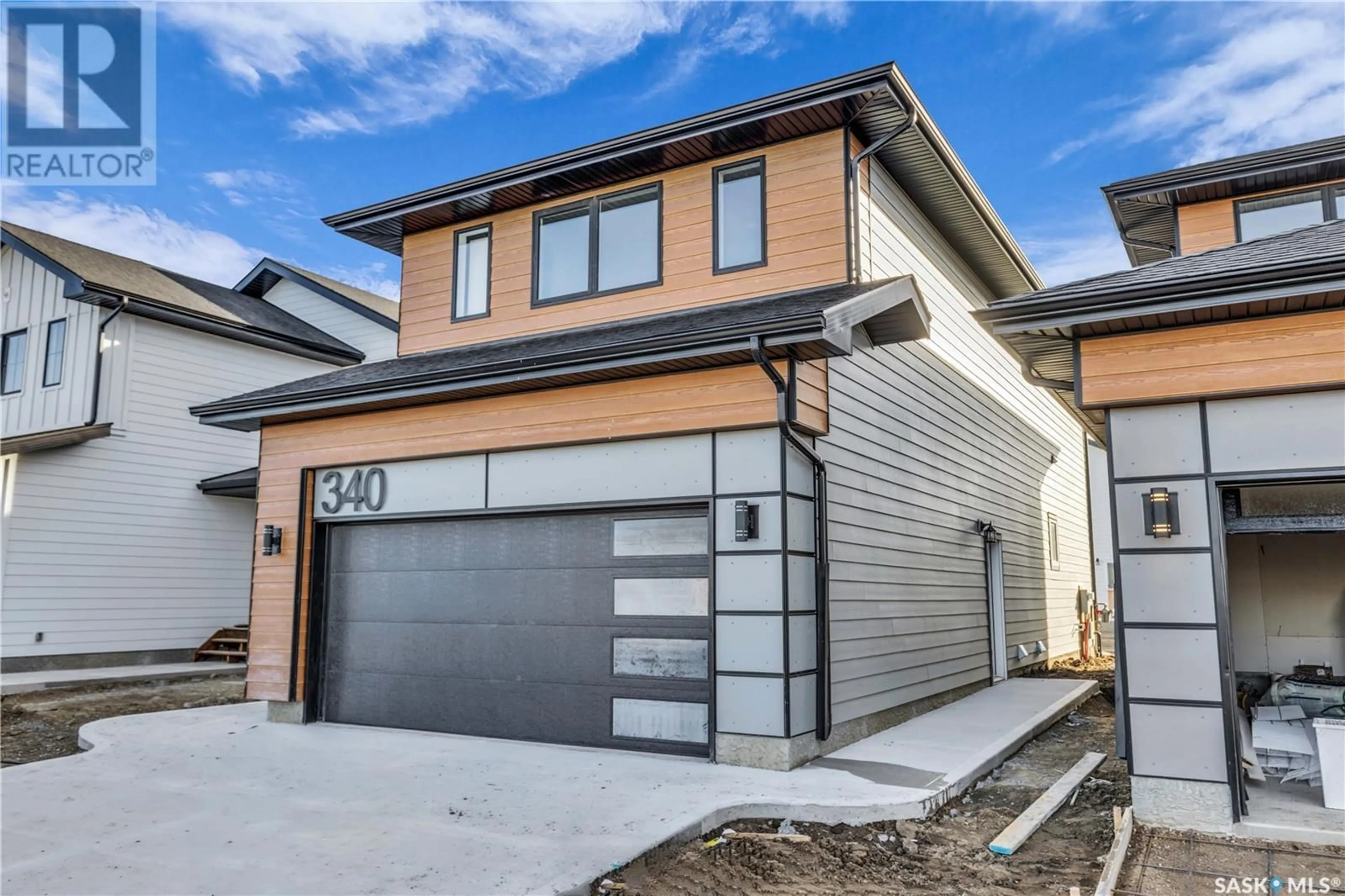 Home with brick exterior material, street for 143 LESKIW LANE, Saskatoon Saskatchewan S7V1R5