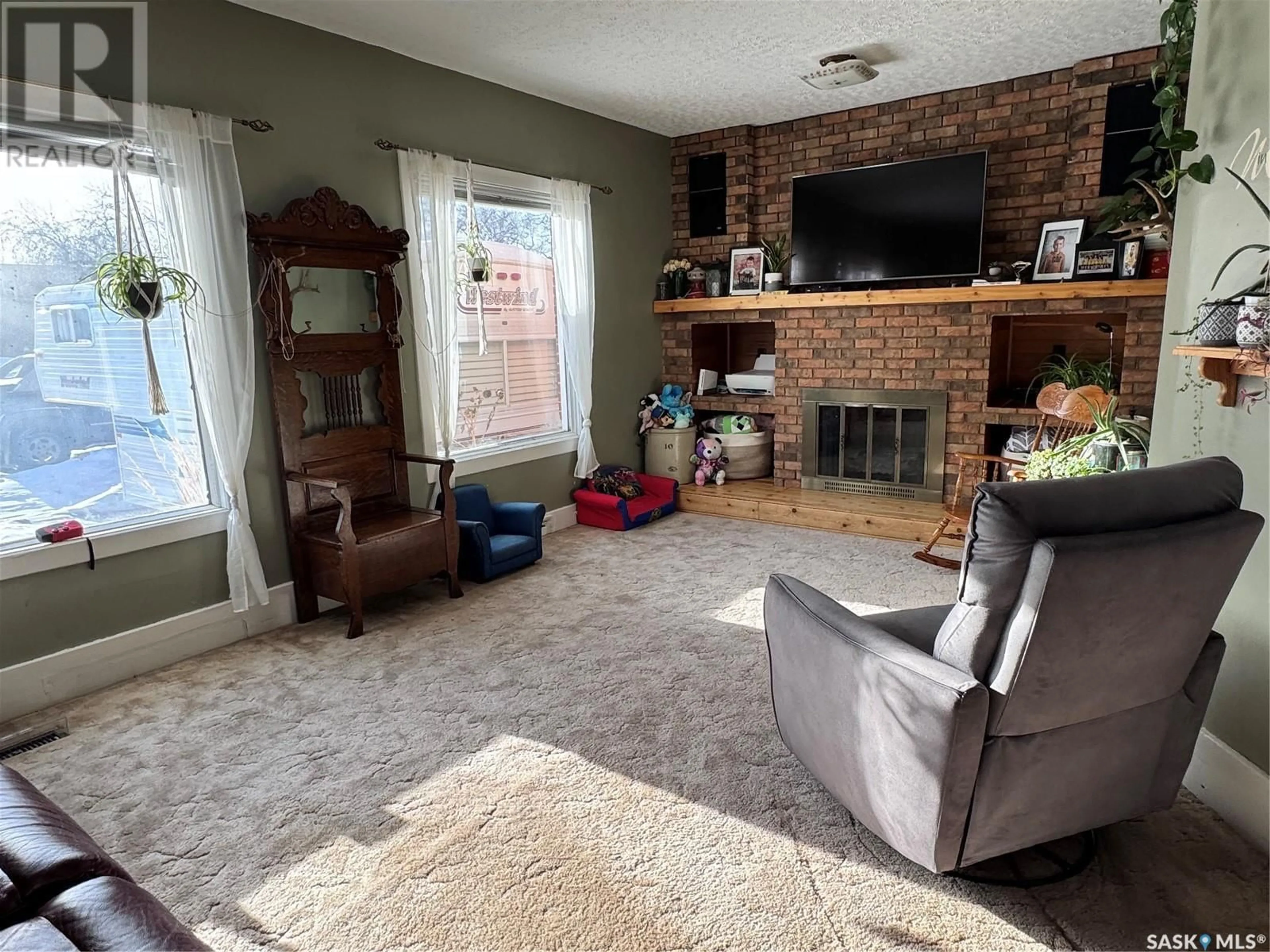 Living room with furniture, unknown for 1409 3rd STREET, Estevan Saskatchewan S4A0S3