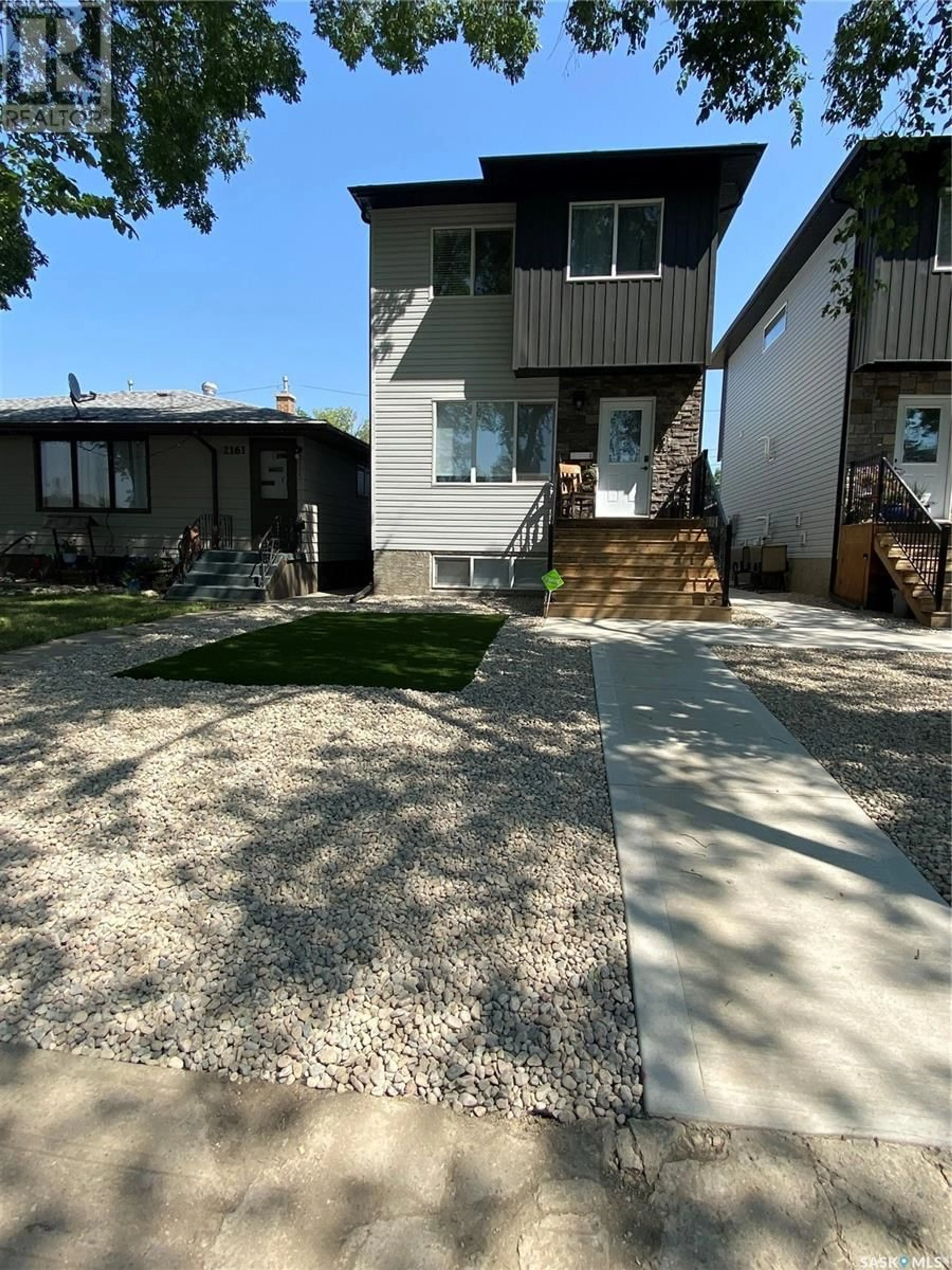 Home with vinyl exterior material, street for 2165 Rothwell STREET, Regina Saskatchewan S4N2C5