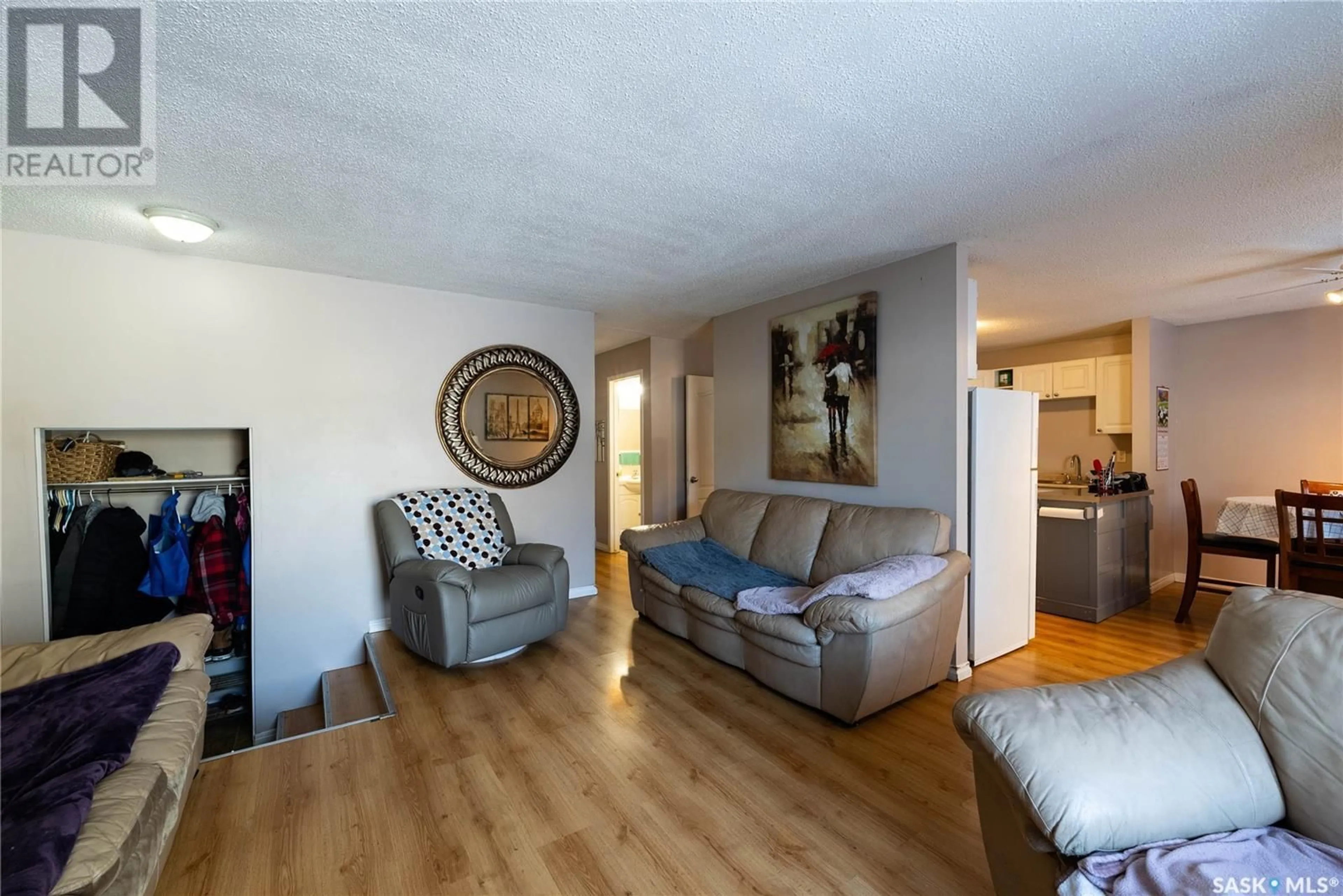 Living room with furniture, wood/laminate floor for 6910 Dalgliesh DRIVE, Regina Saskatchewan S4X2M6