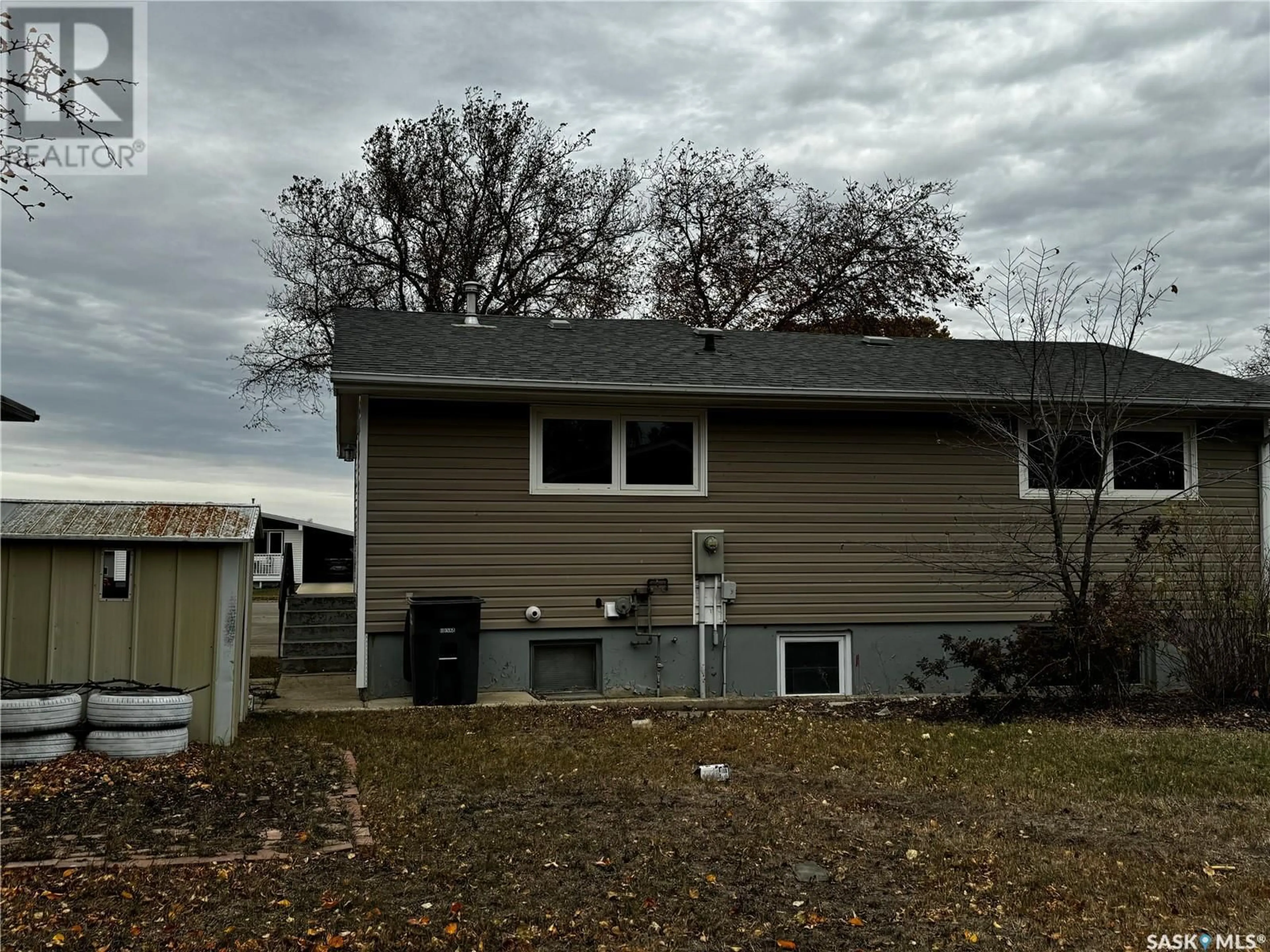 Home with vinyl exterior material, street for 243 Dominion ROAD, Assiniboia Saskatchewan S0H0B0