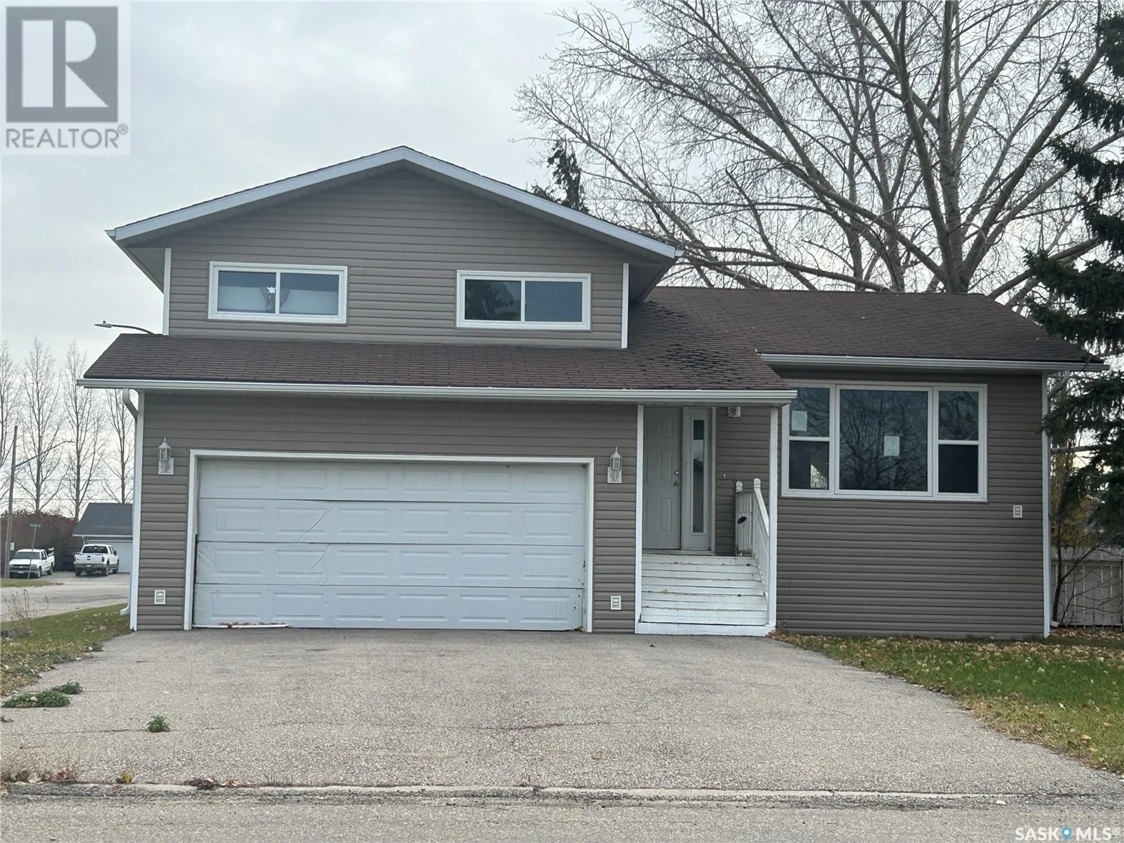 Home with vinyl exterior material, street for 310 Staffa STREET, Colonsay Saskatchewan S0K0Y0