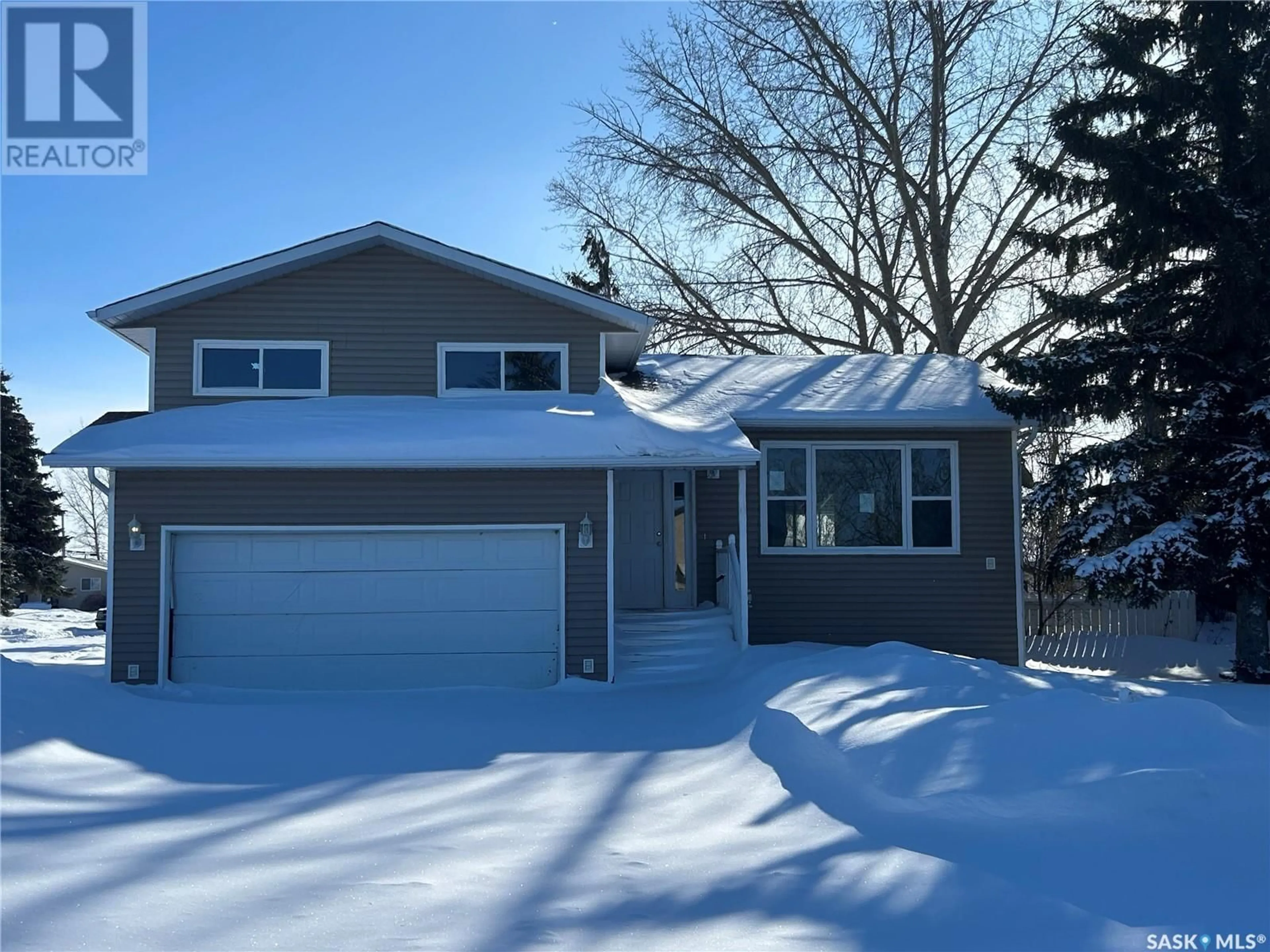 Home with vinyl exterior material, street for 310 Staffa STREET, Colonsay Saskatchewan S0K0Y0