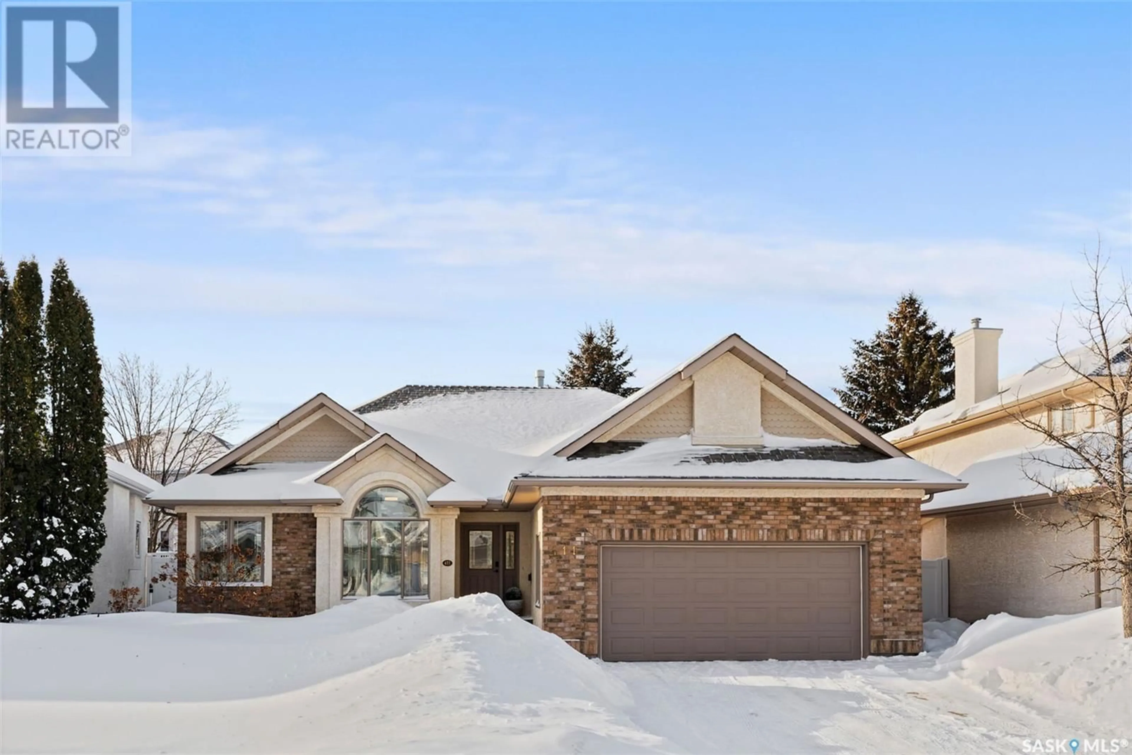 Home with brick exterior material, street for 411 Collins CRESCENT, Saskatoon Saskatchewan S7N4K7