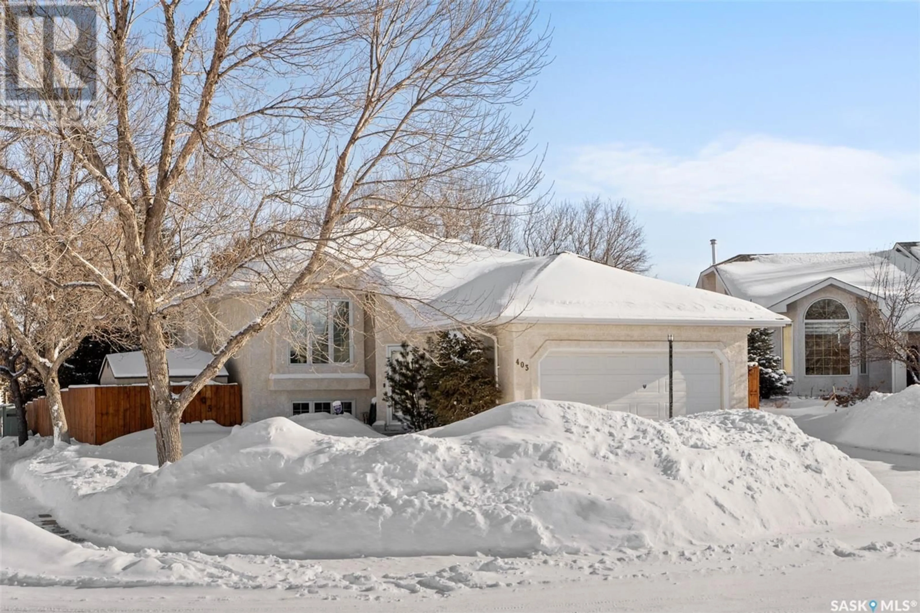 Home with vinyl exterior material, street for 403 Caldwell PLACE, Saskatoon Saskatchewan S7M5S7