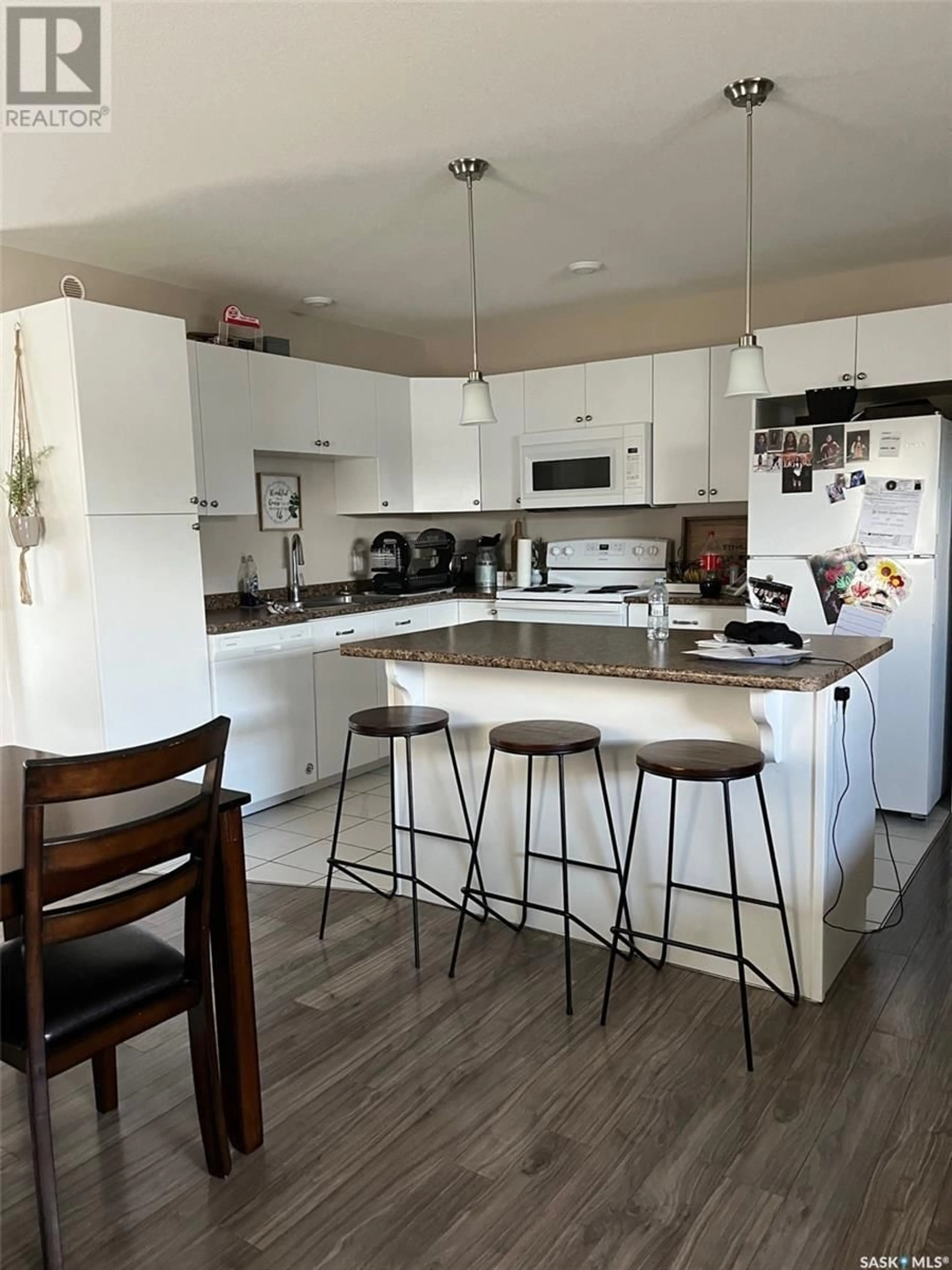 Open concept kitchen, wood/laminate floor for E - 833 & 835 5TH STREET, Prince Albert Saskatchewan S6V6N1